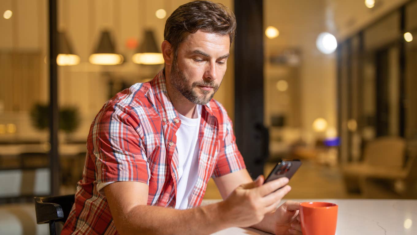 Man changing his phone settings to protect his sensitive information