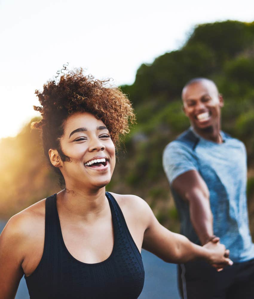 couple running outside, happy to be each other's greatest love