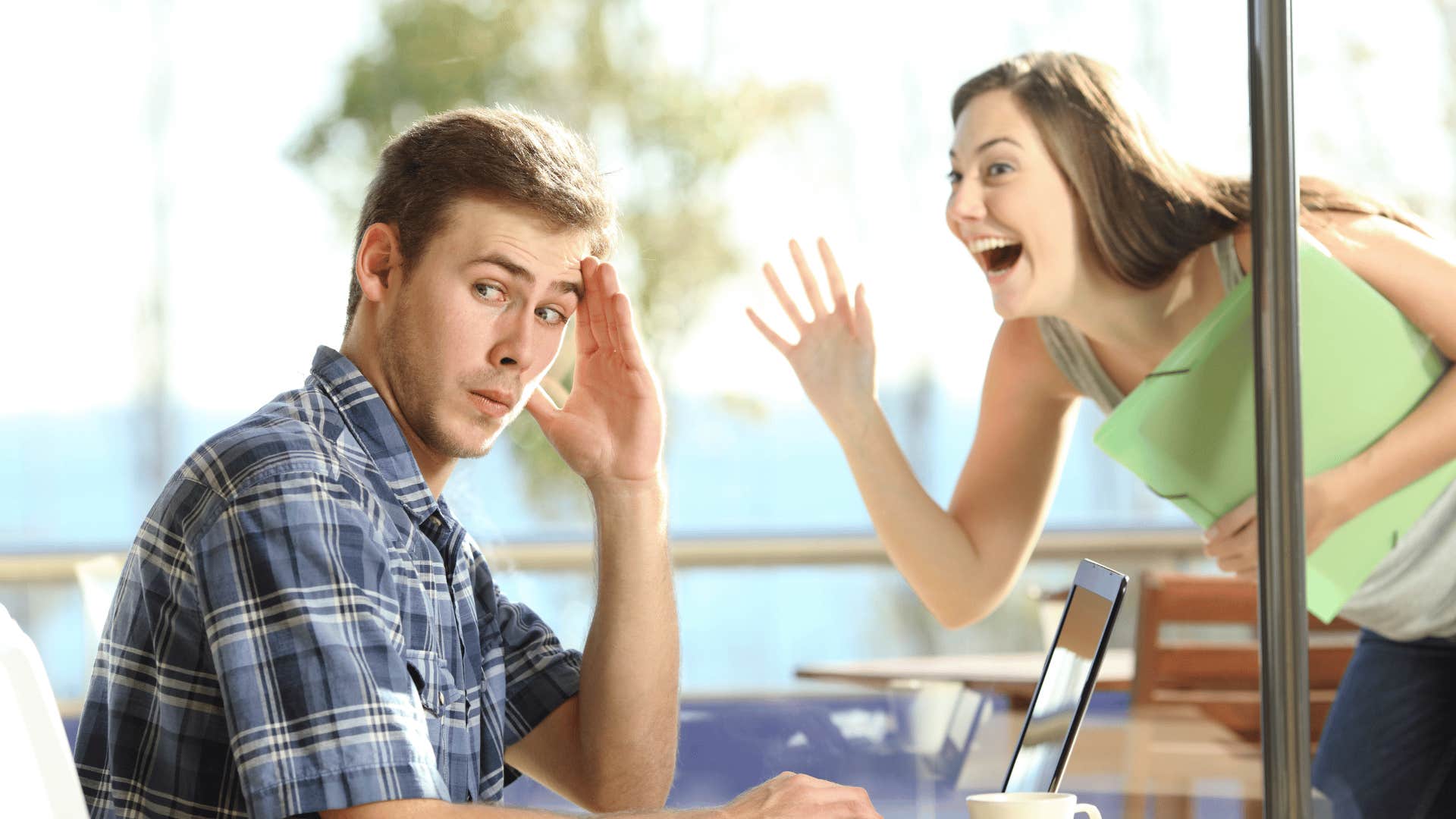 man ignoring woman outside window