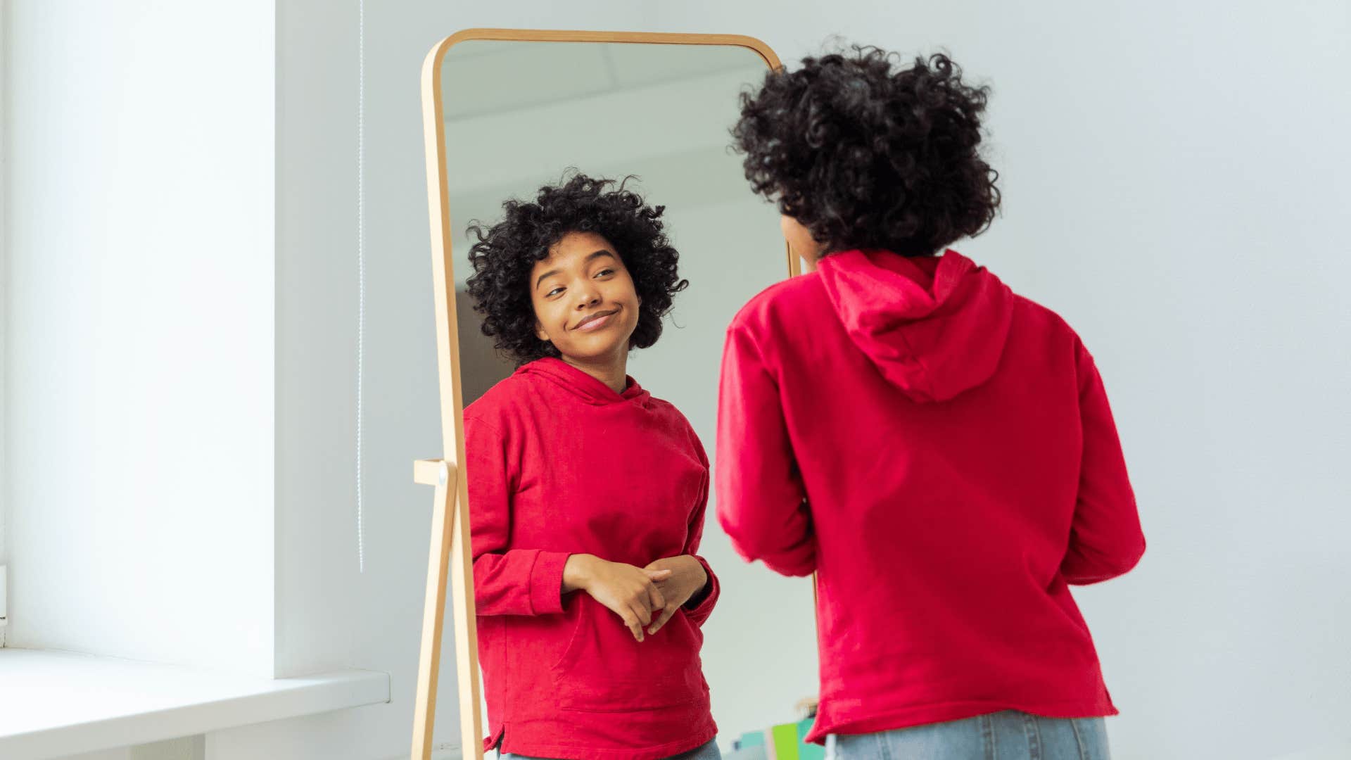 woman smiling in mirror