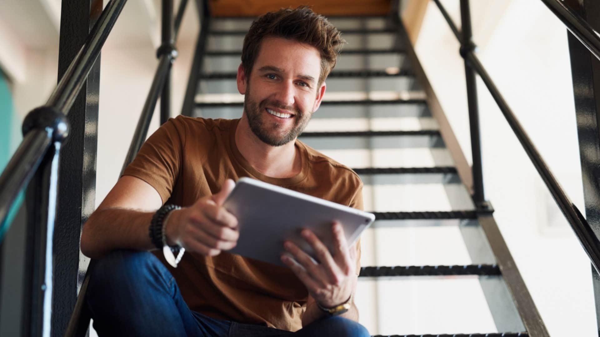 man sitting in stairwell