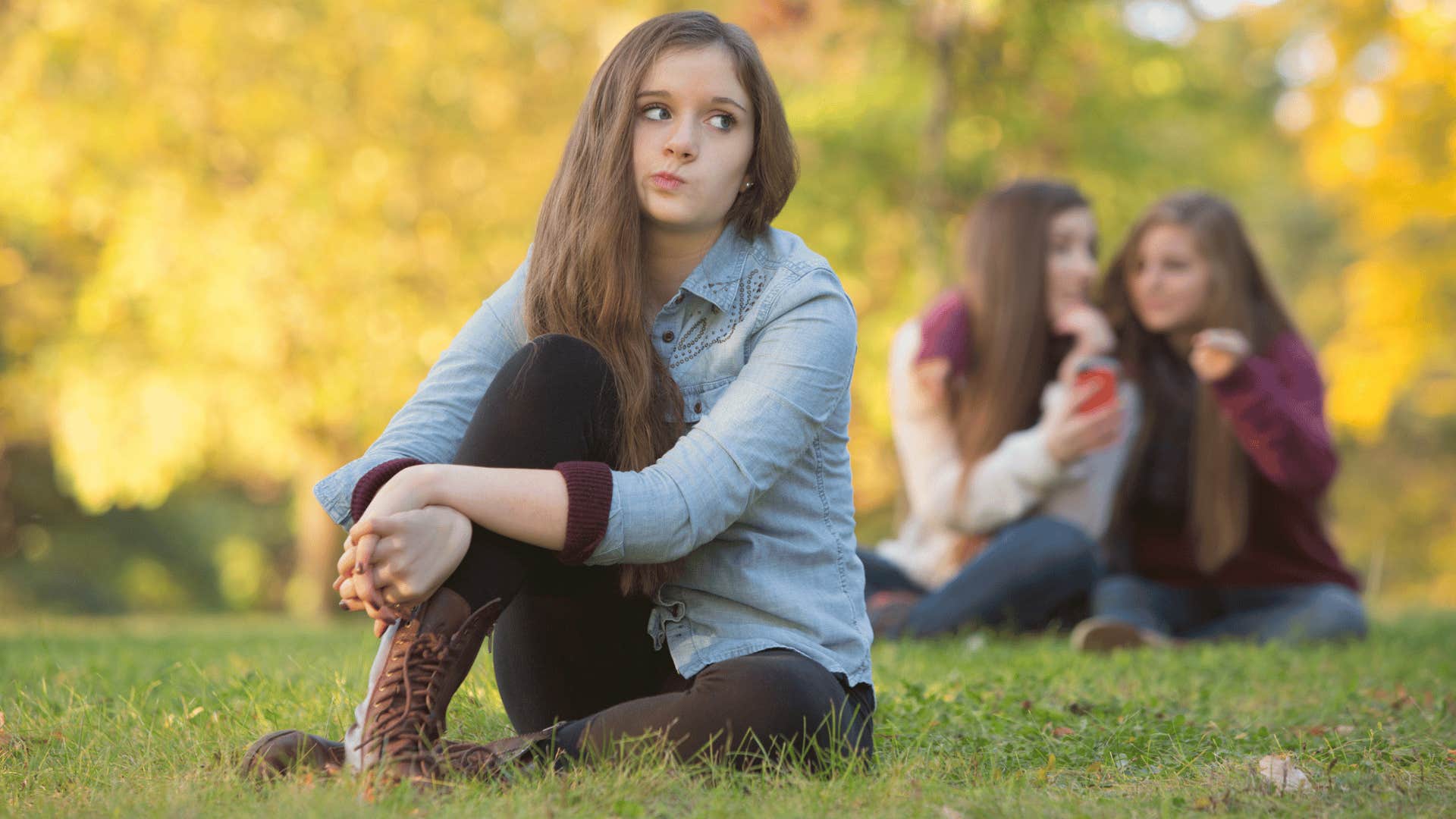 young woman sitting alone