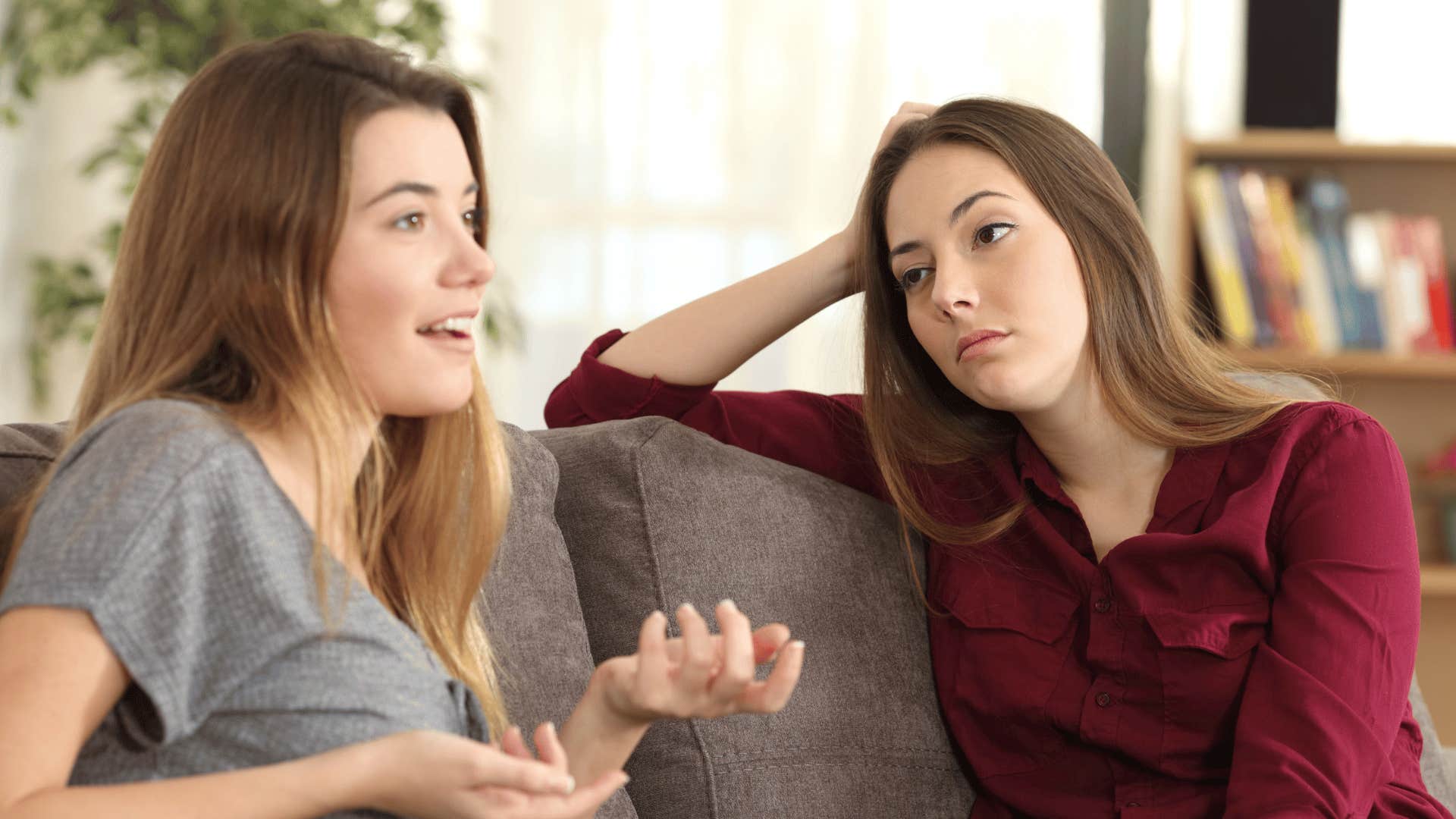 bored friend listening to woman speak