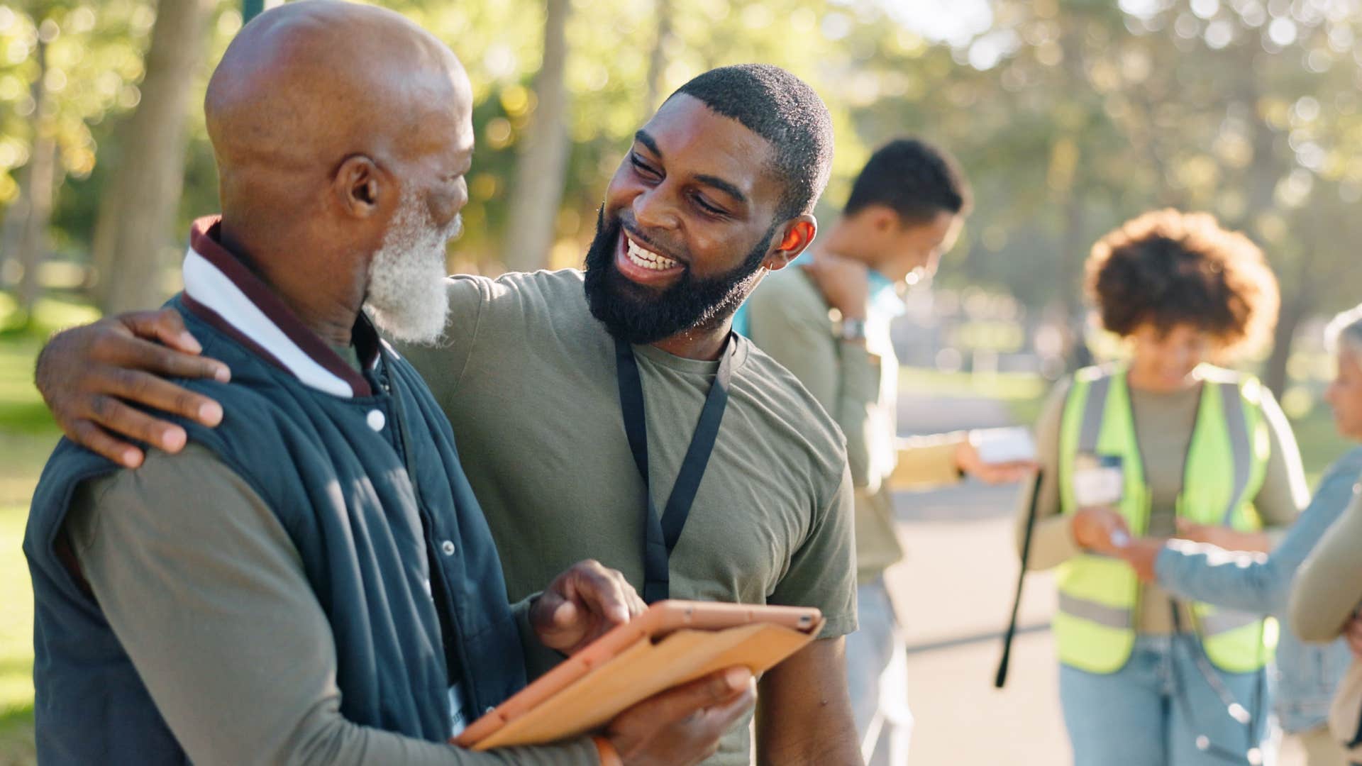 positive man talking to older man