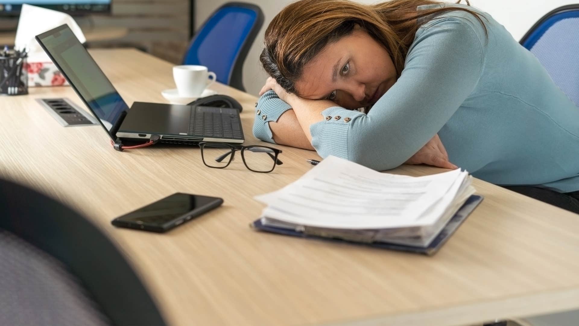 woman giving up putting her head down