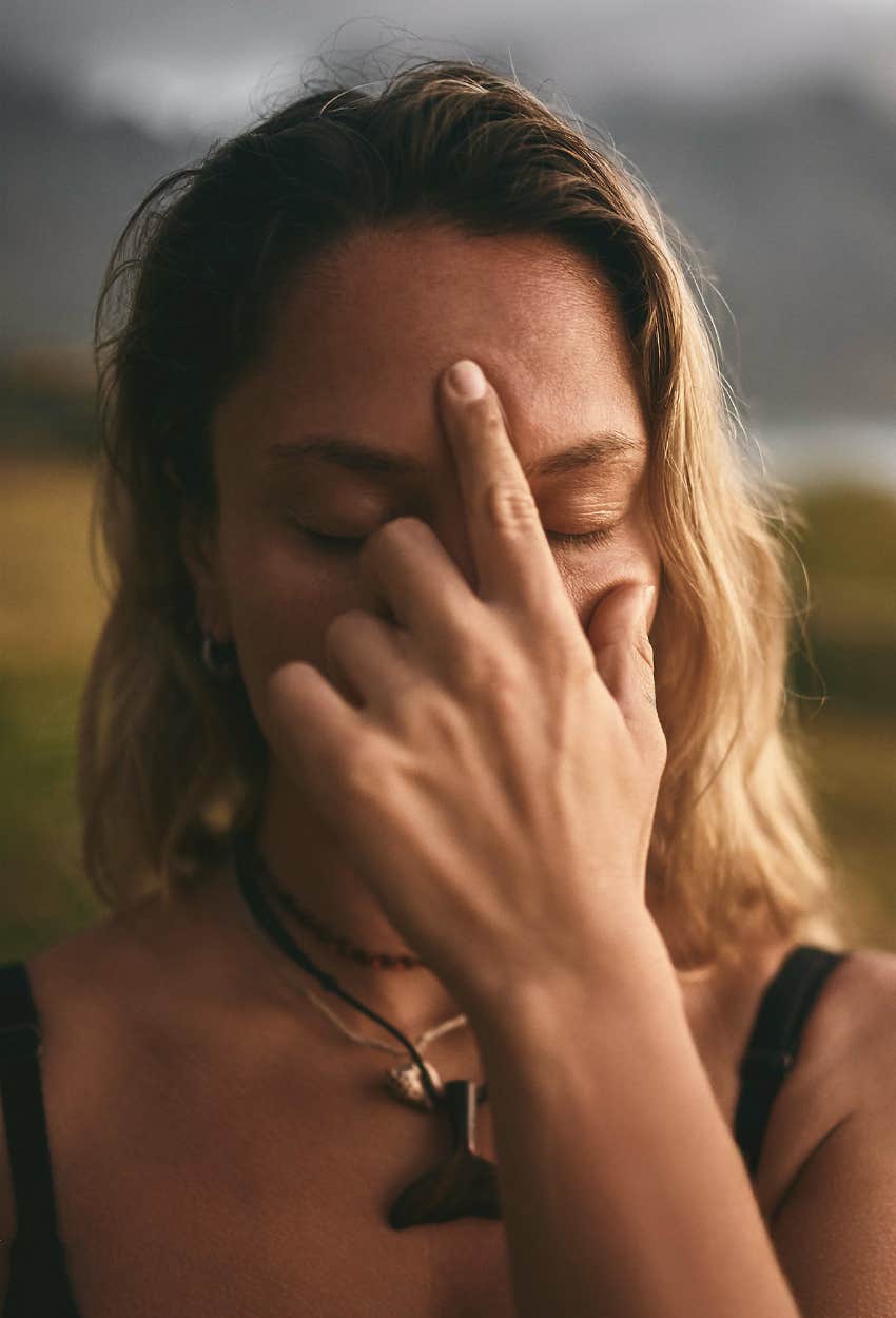 Woman acknowledging her third eye is open and protecting her