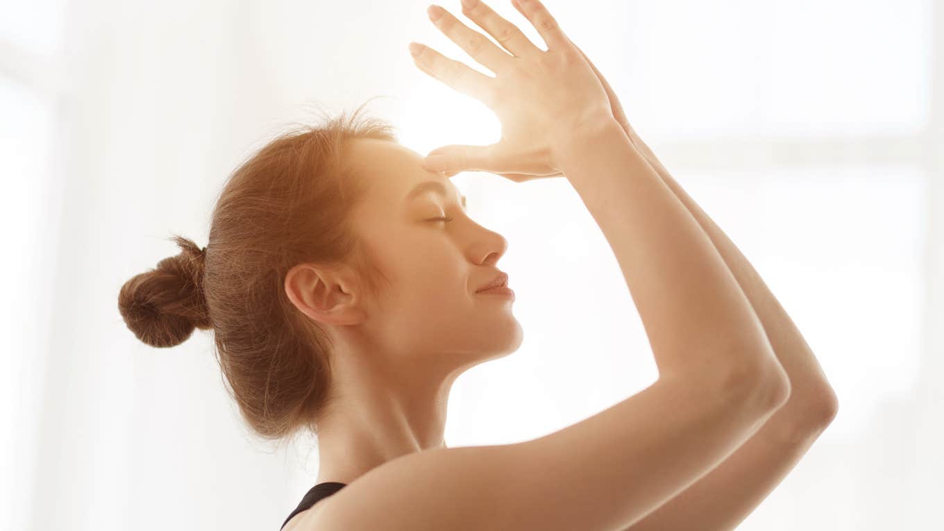 Woman touching her third eye 