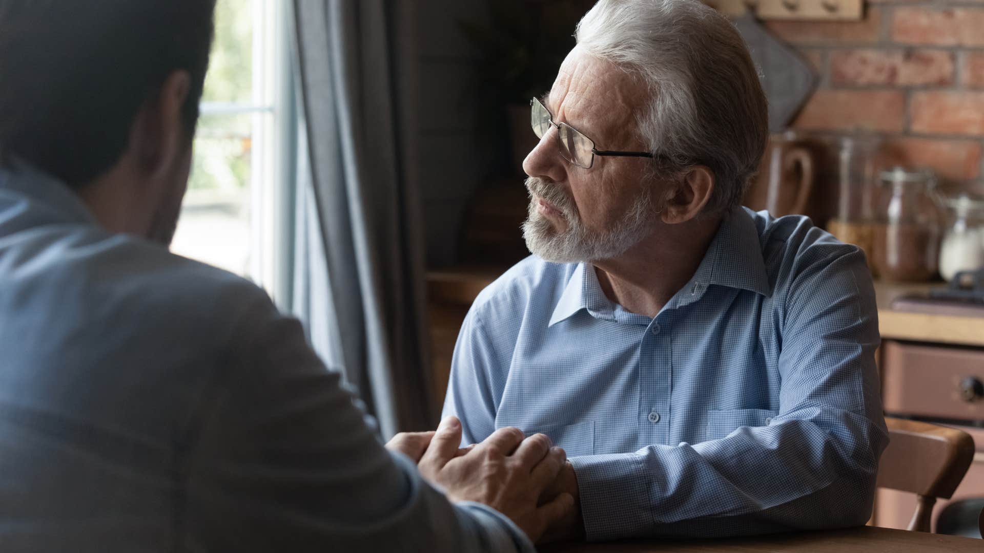 older man thinking about the past