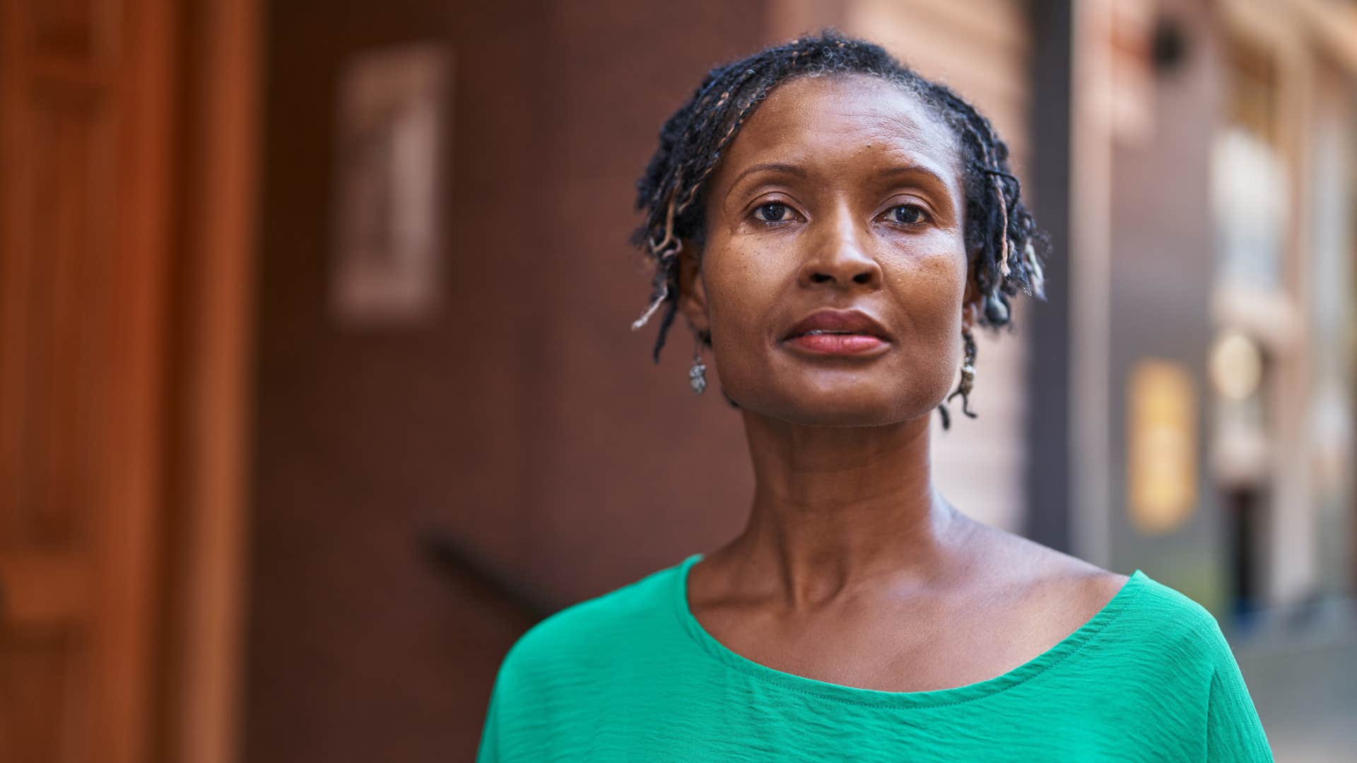 serious woman standing outside