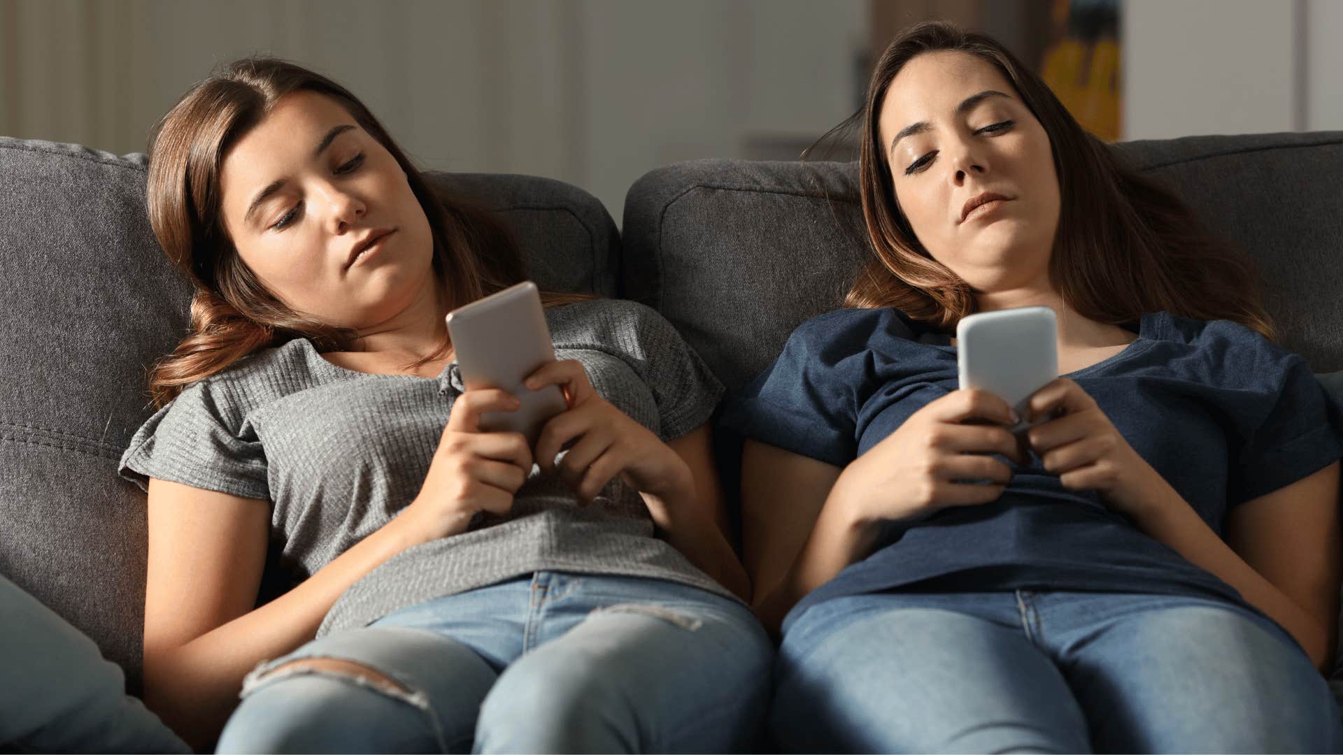 two friends ignoring each other on the phone