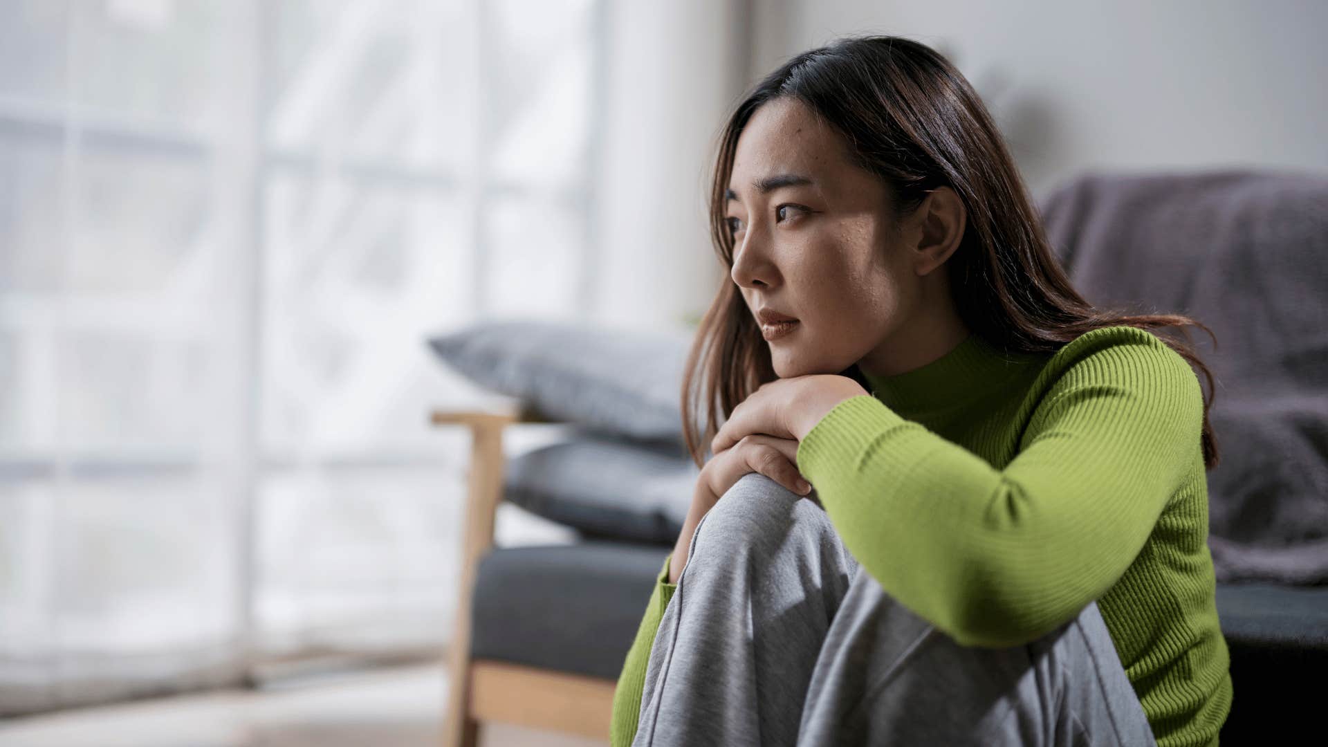 lonely woman sitting on the floor