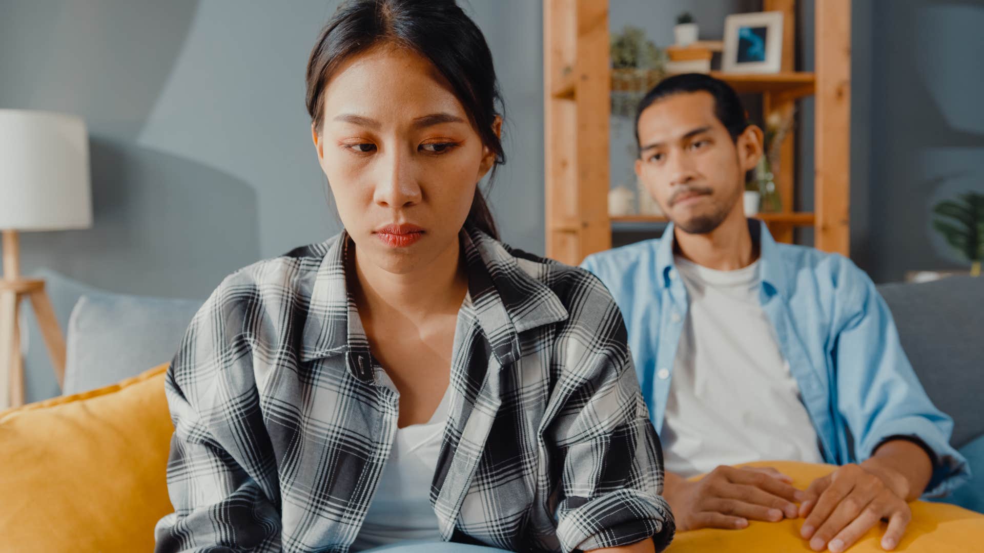 upset couple sitting away from each other