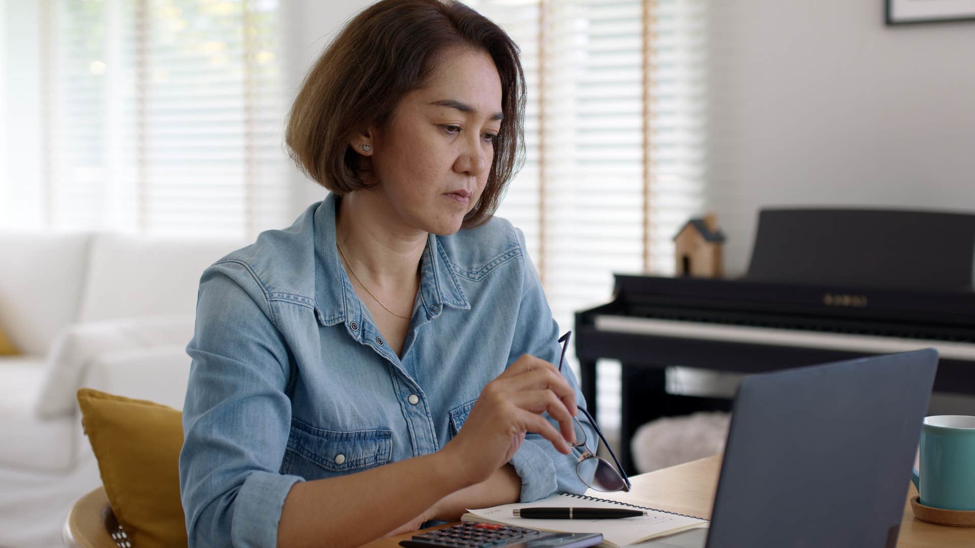 tired woman working on her laptop