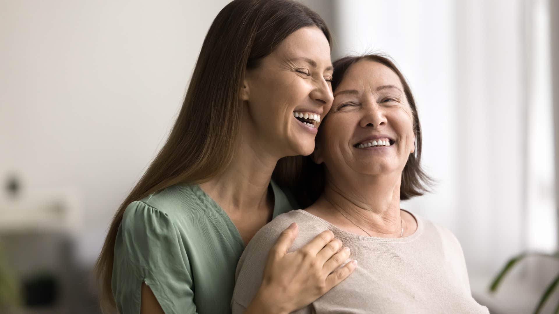 woman hugging her older mother