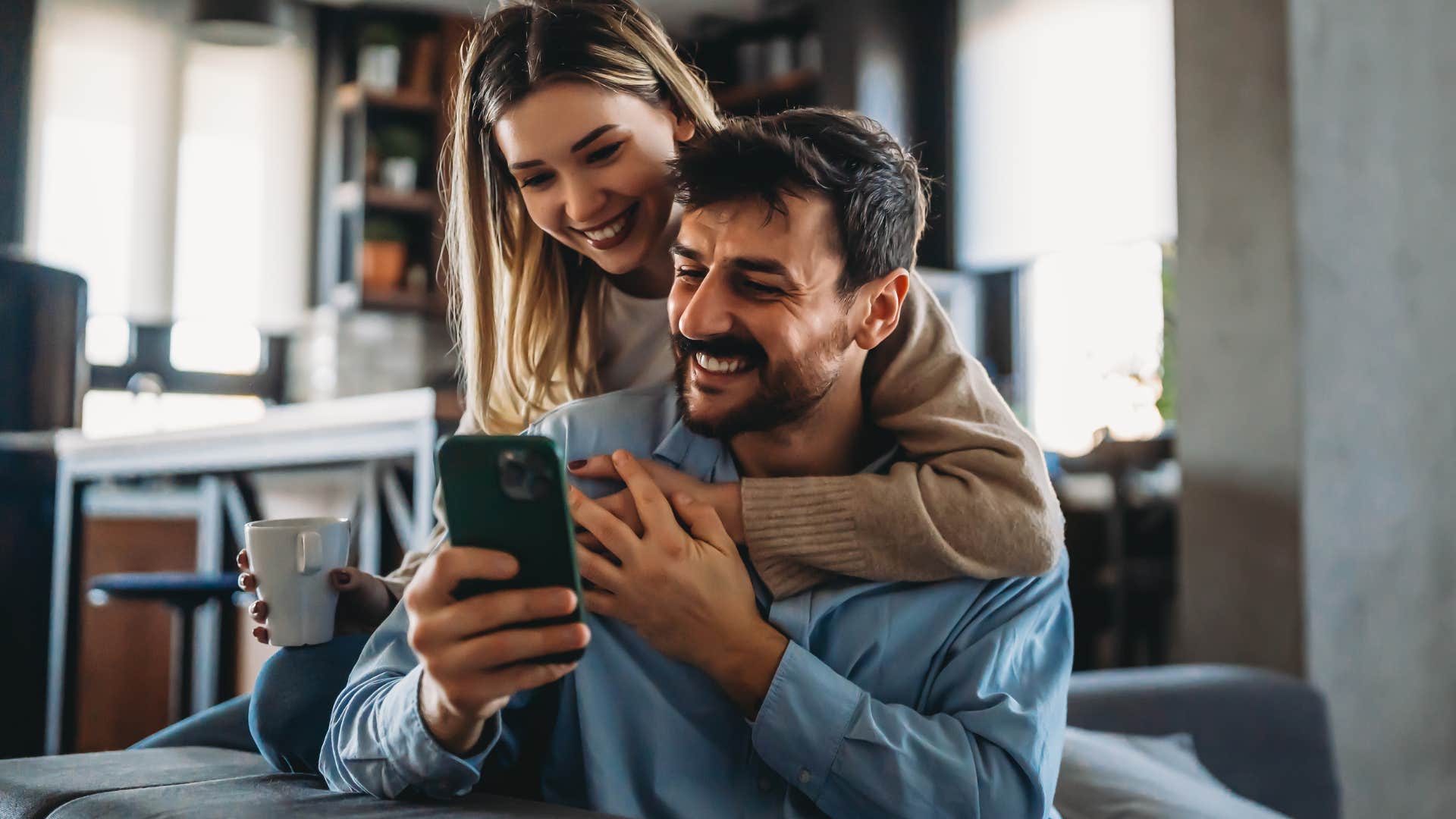 couple smiling and hugging each other