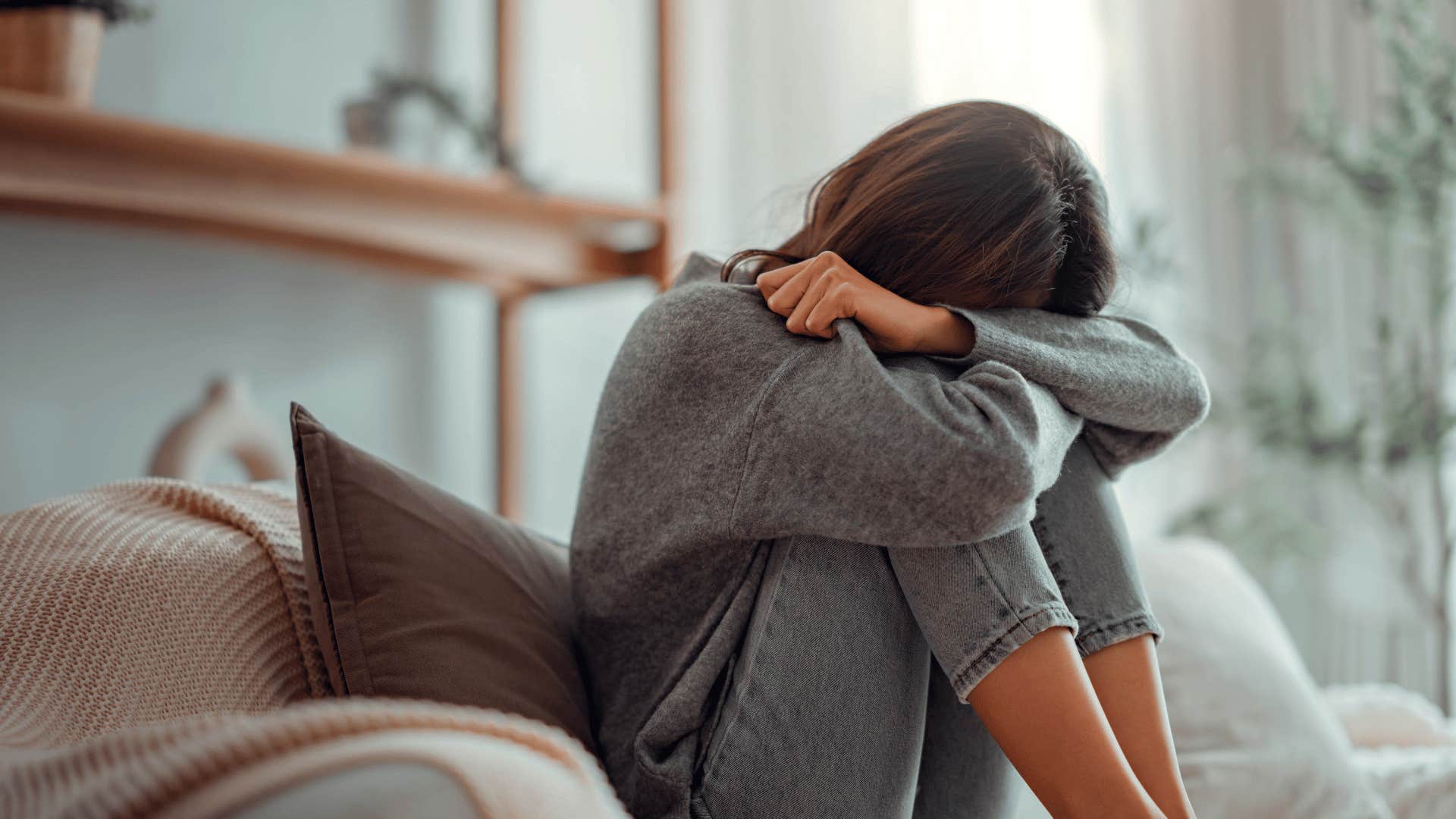 upset woman on bed