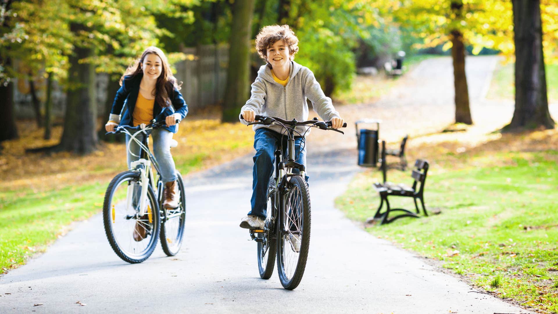 children riding two-wheeler bikes