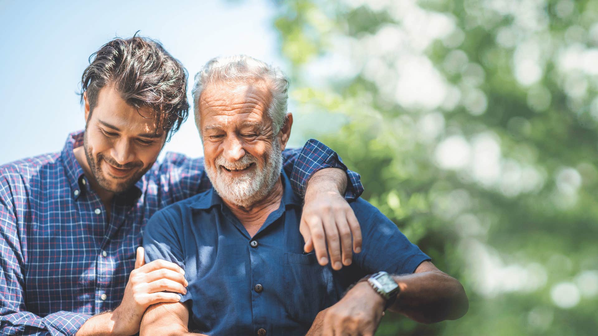 young man walking with older man