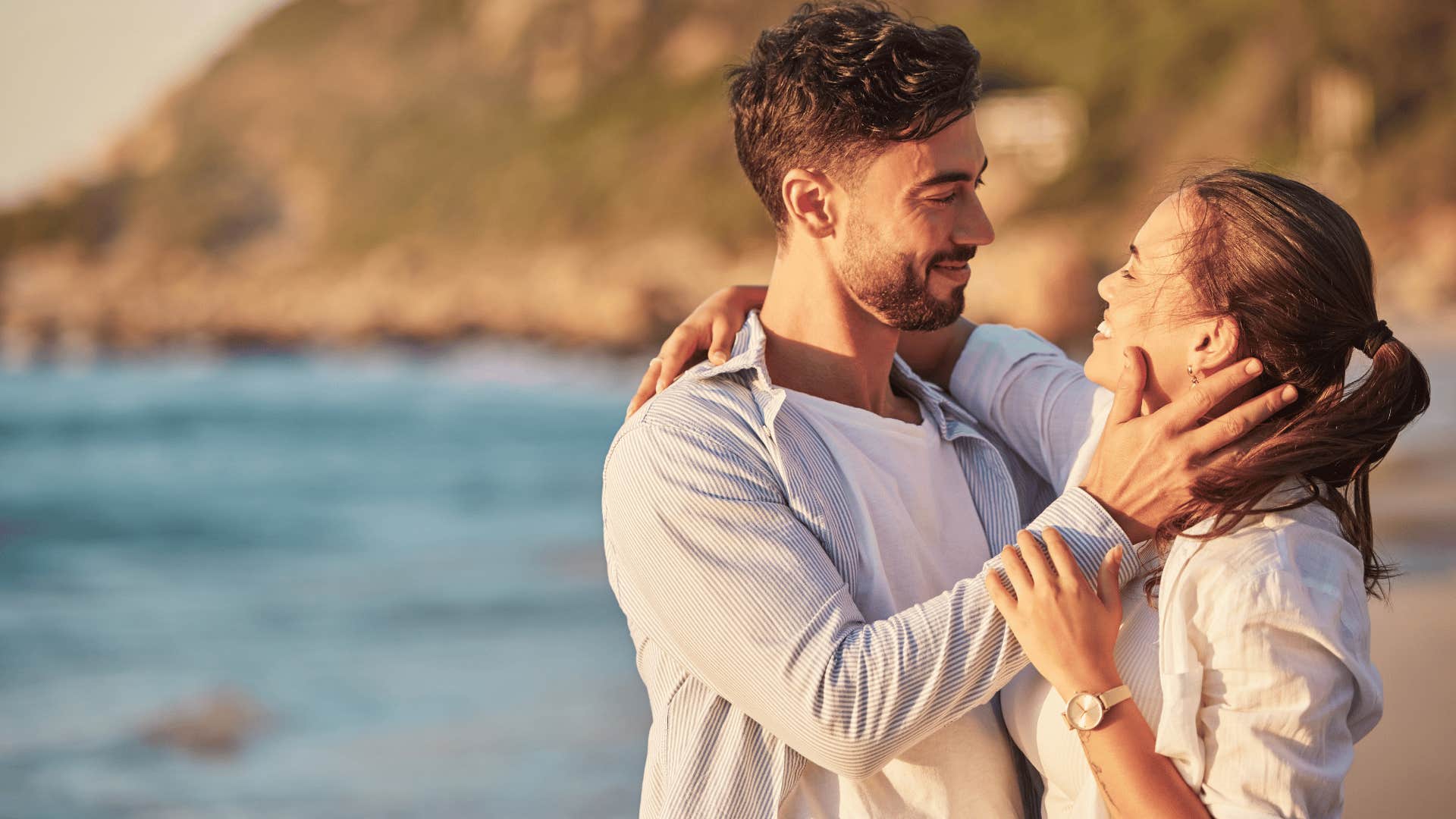 couple looking at each other on beach