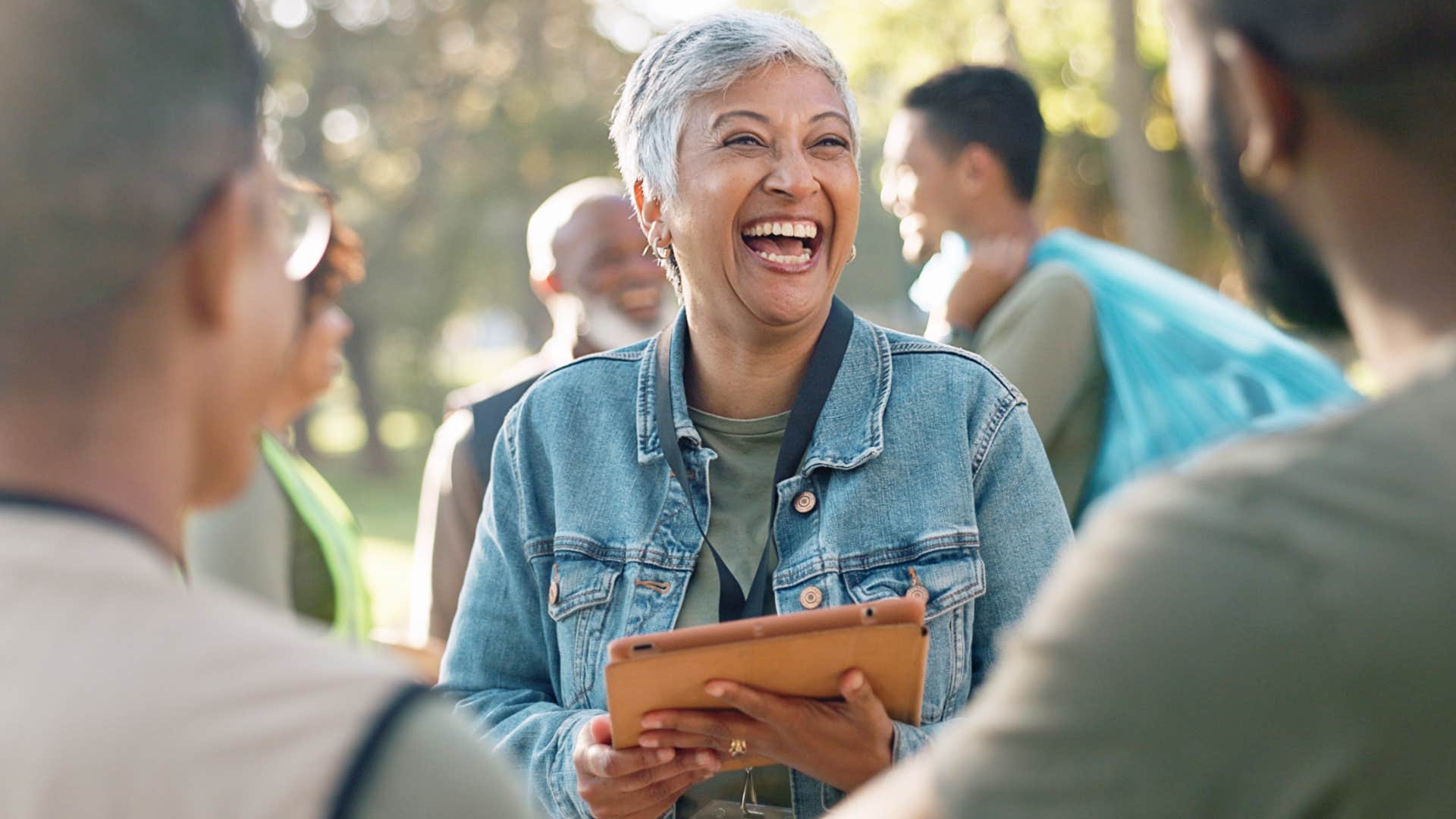 happy practical woman holding clipboard