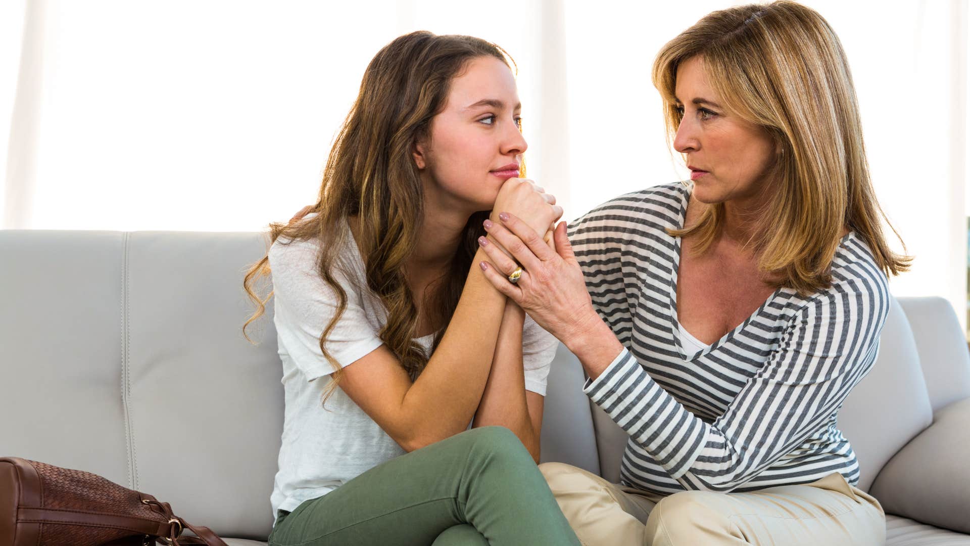 young woman being comforted