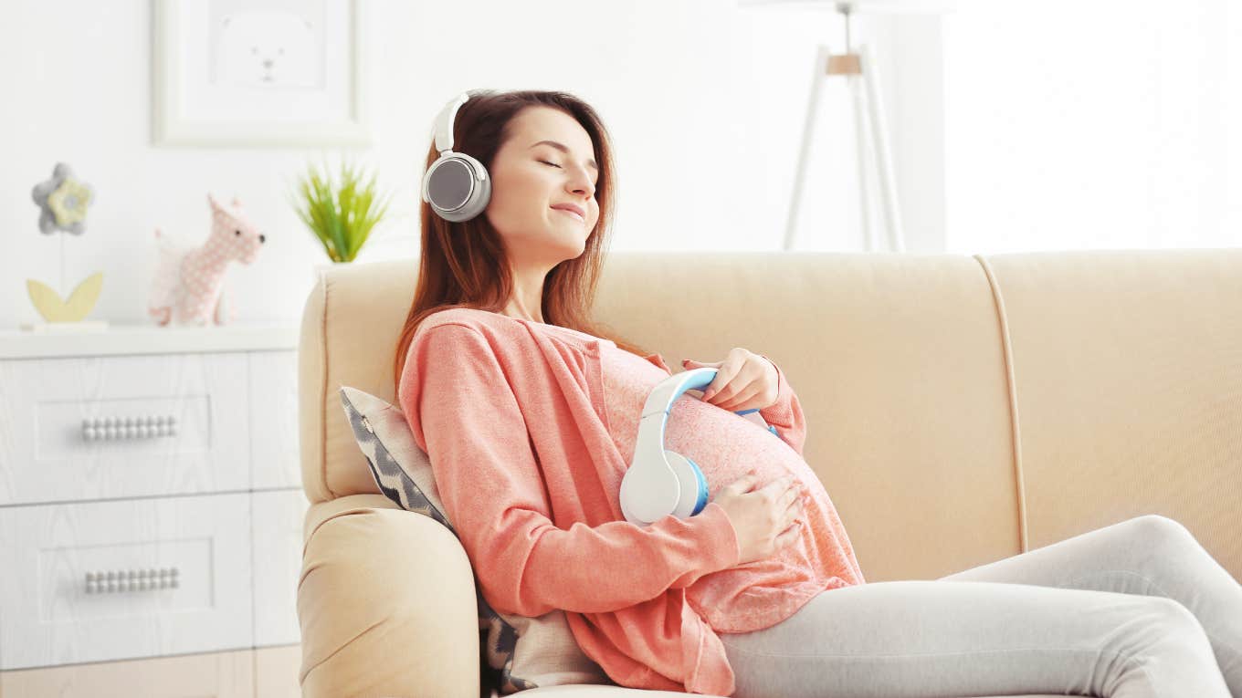 Woman listening to a specific type of music to calm her unborn baby