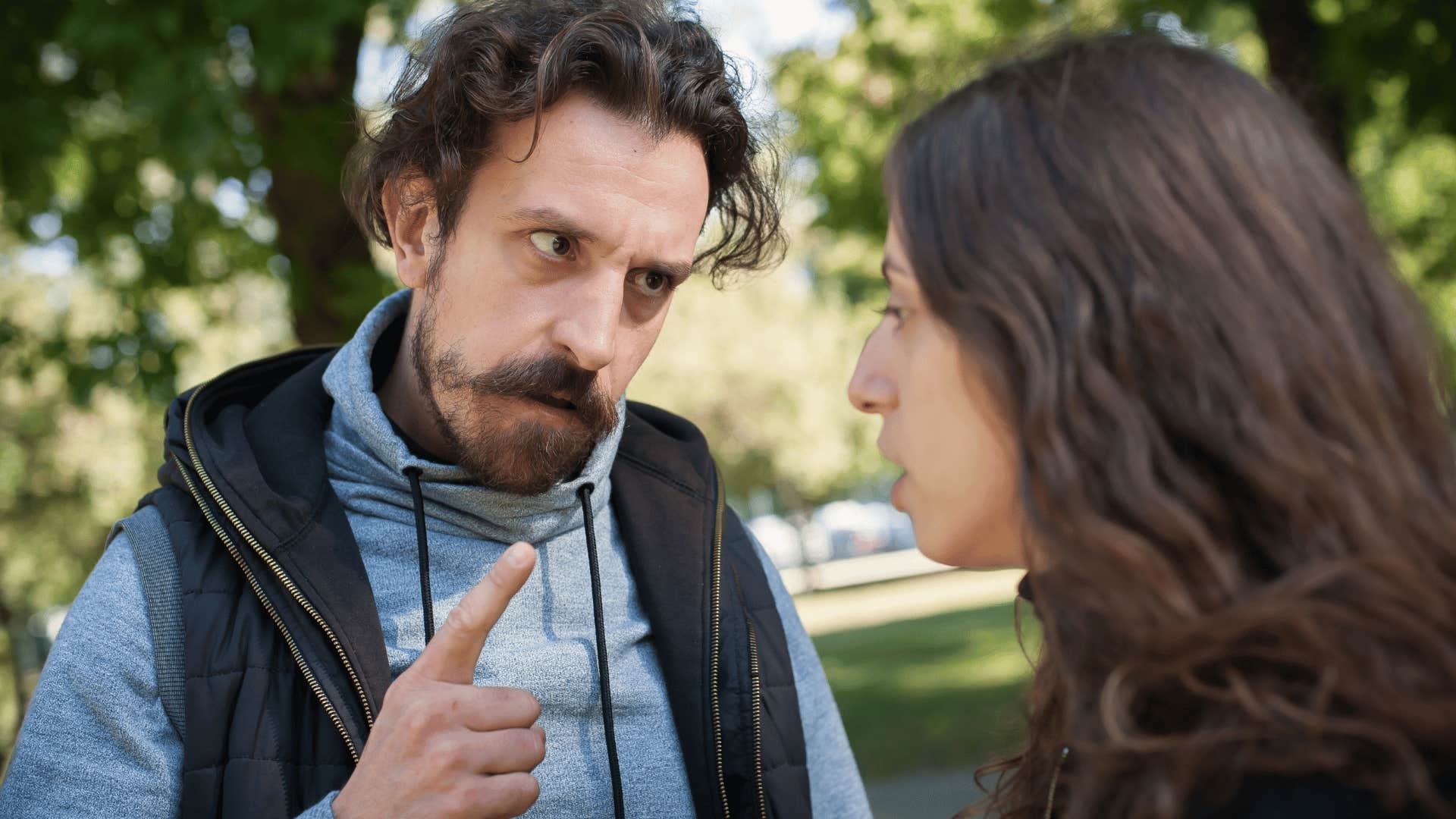 man yelling at woman outside