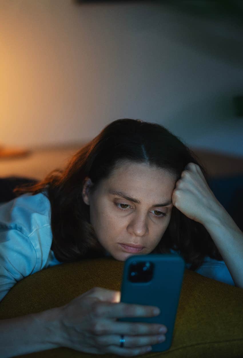 Woman whose mental health is slipping scrolling on her phone