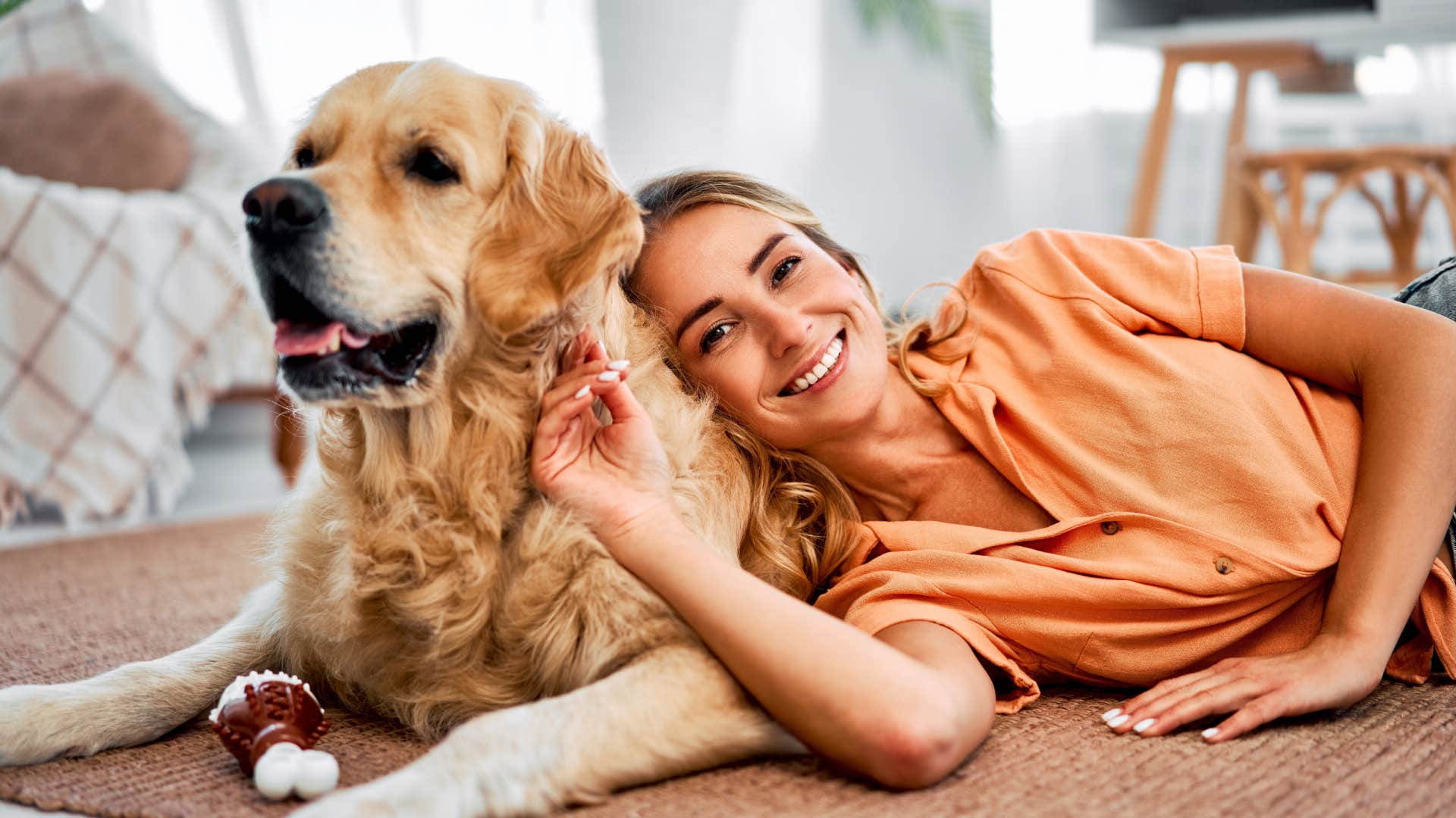 woman resting on floor with dog