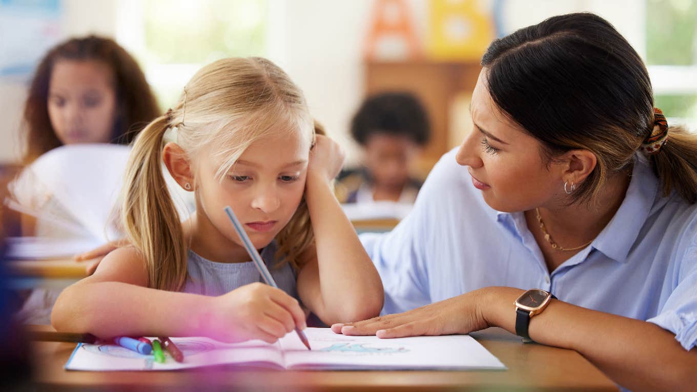 teacher helping student in need