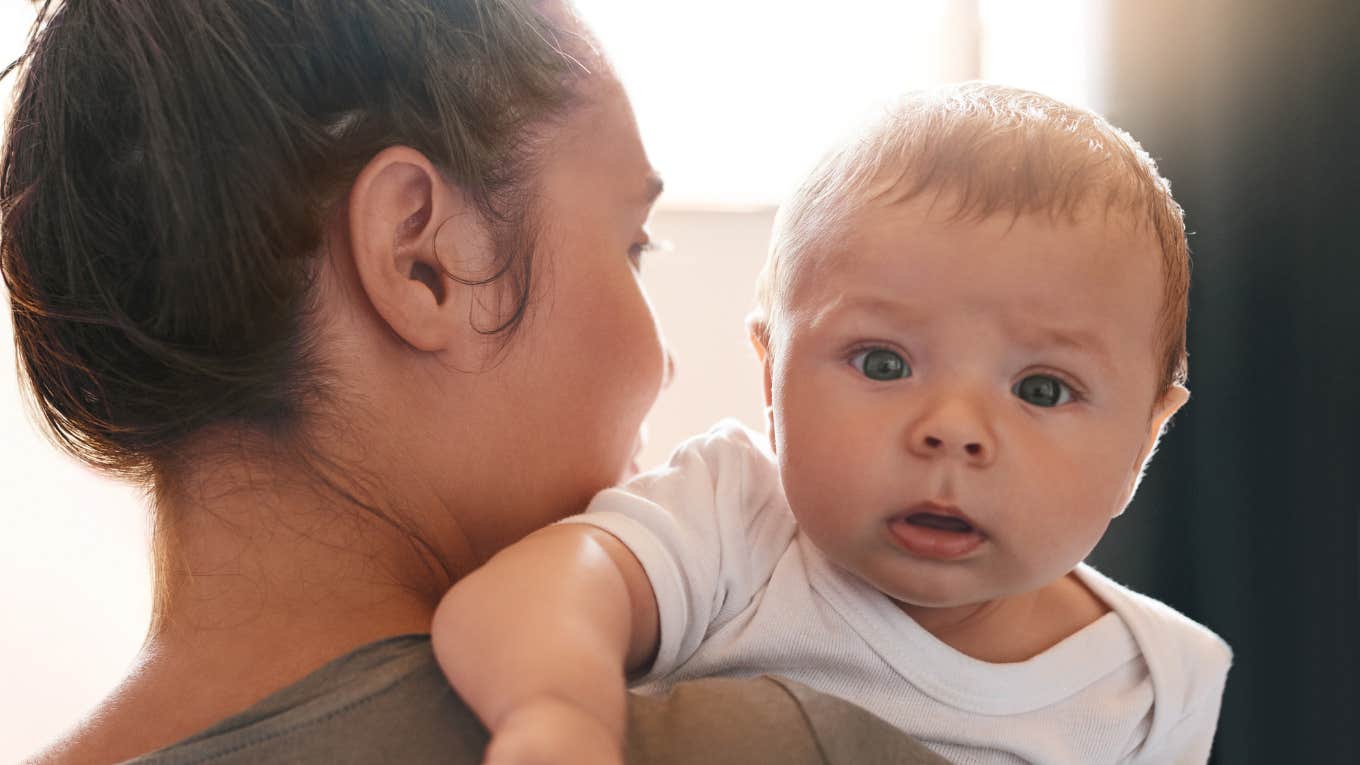 Woman with baby wonders why she hates being a mother