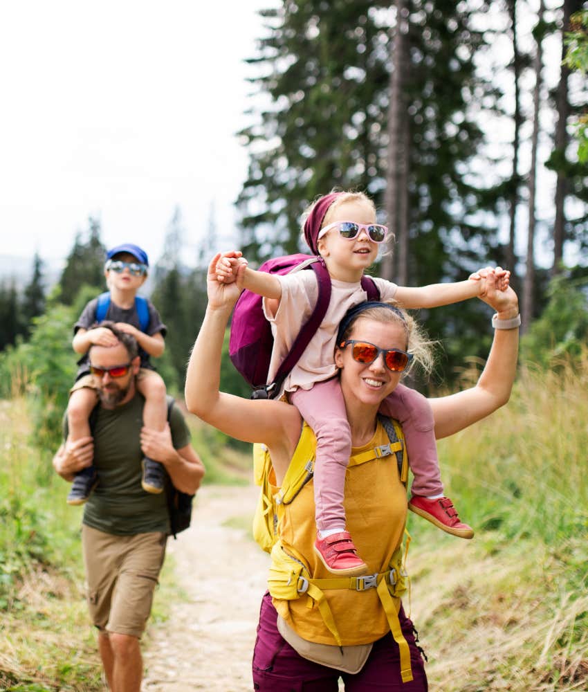 Family with small children hiking to build natural leaders