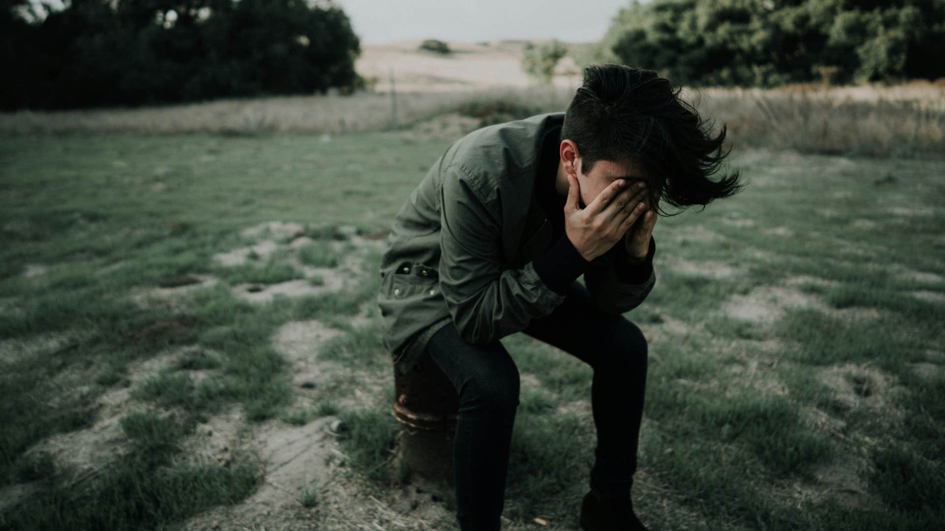 frustrated man with his head in his hands