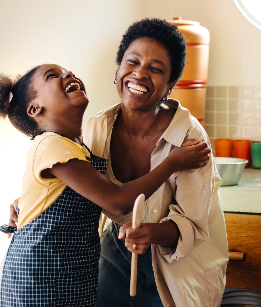 girl and her mom laughing happily