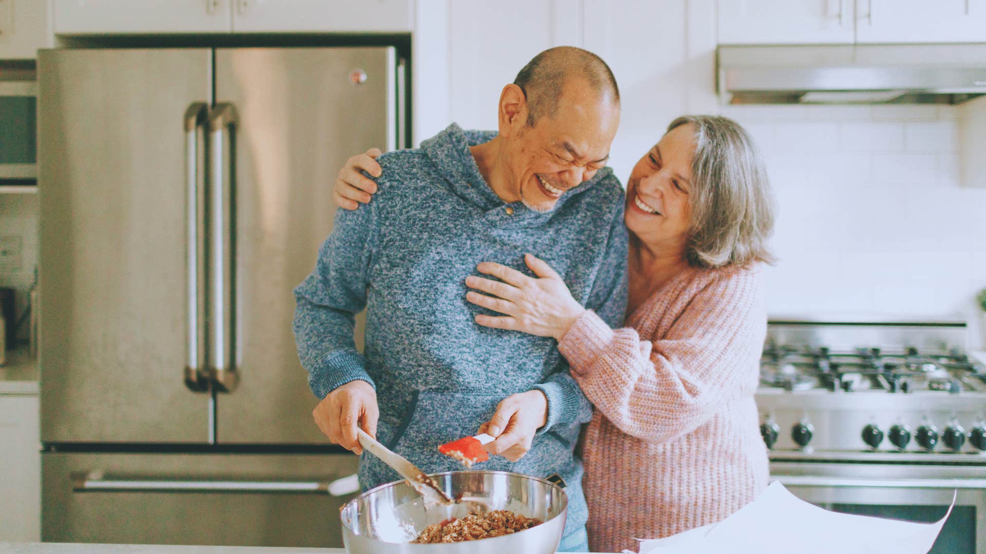 husband helping his wife make dinner