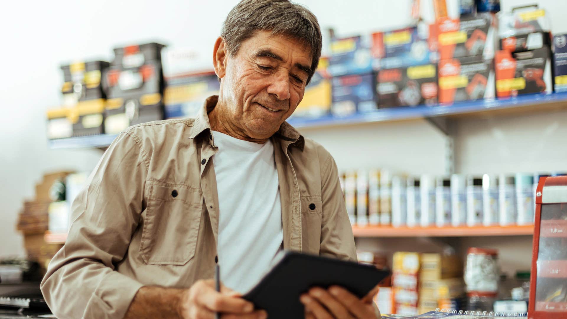 Boomer man with a bootstrap mentality looking in a hardware store