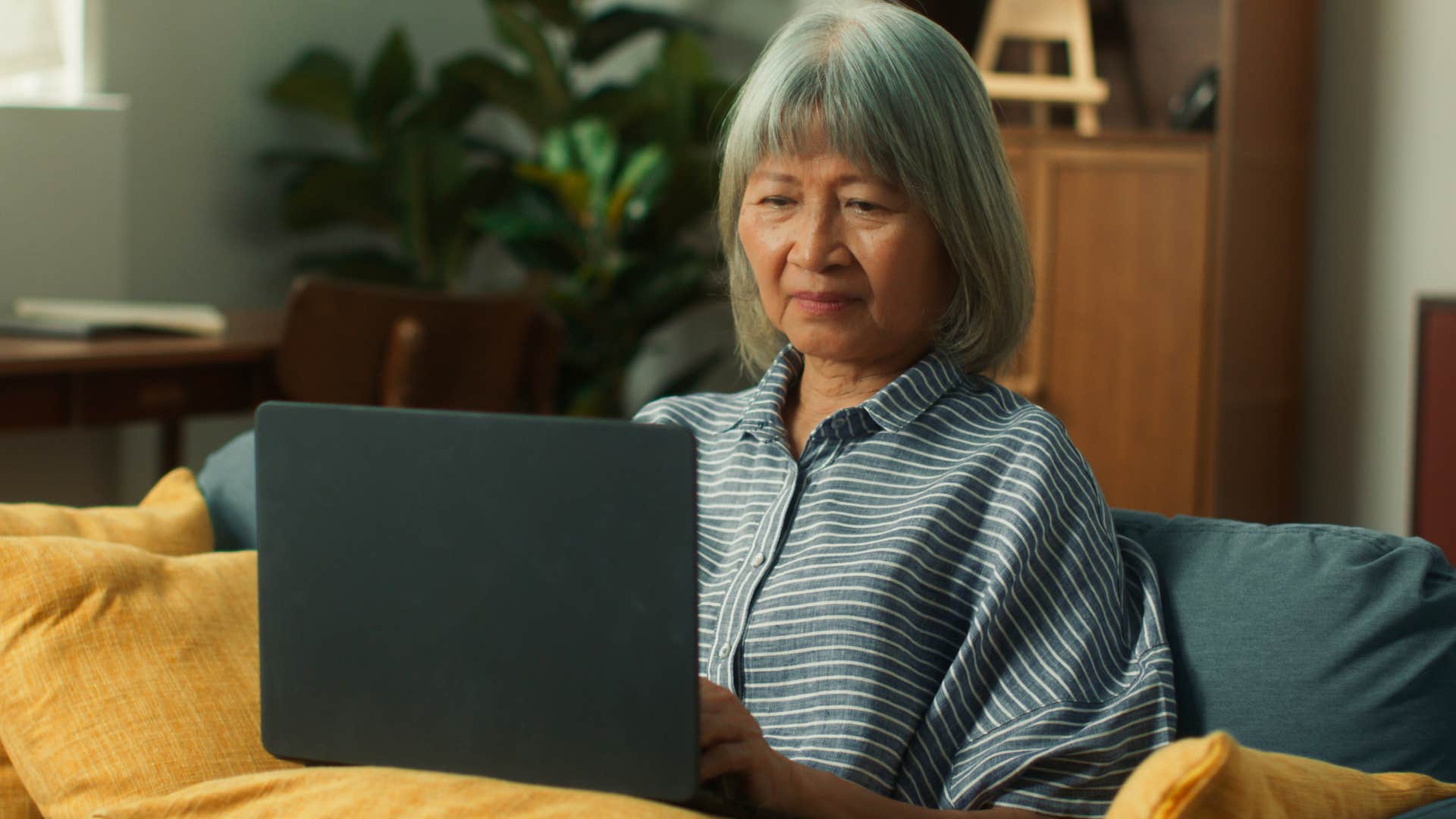 Boomer woman working on her laptop