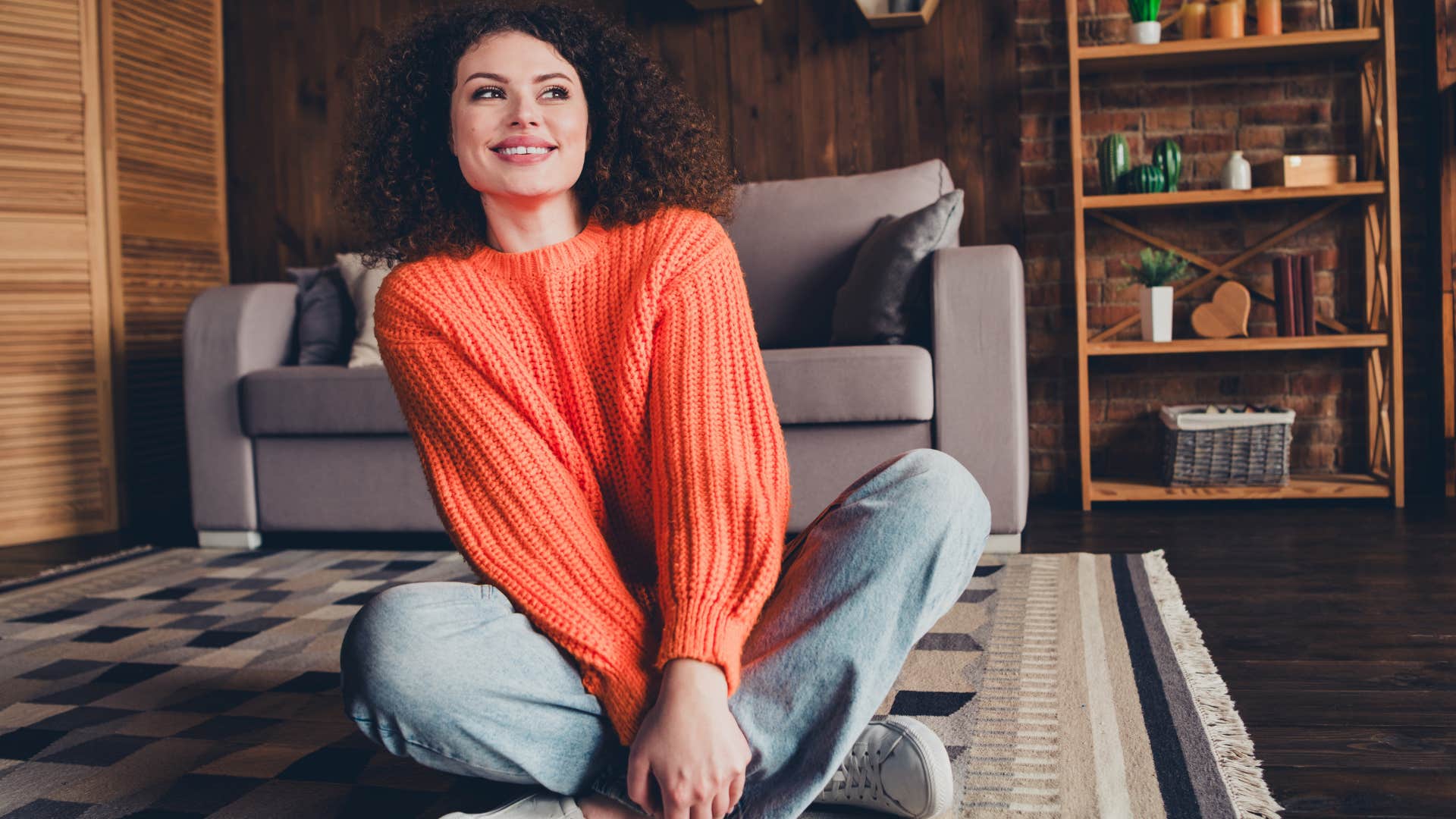 woman sitting on a carpet rug