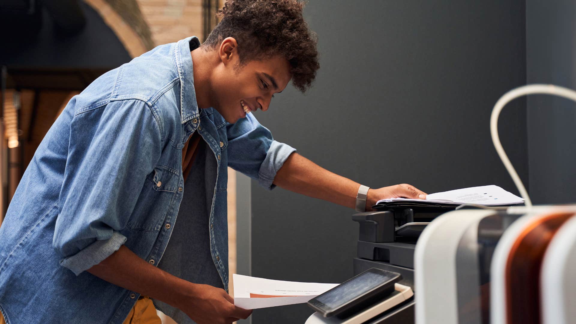 man using an upgraded fax machine