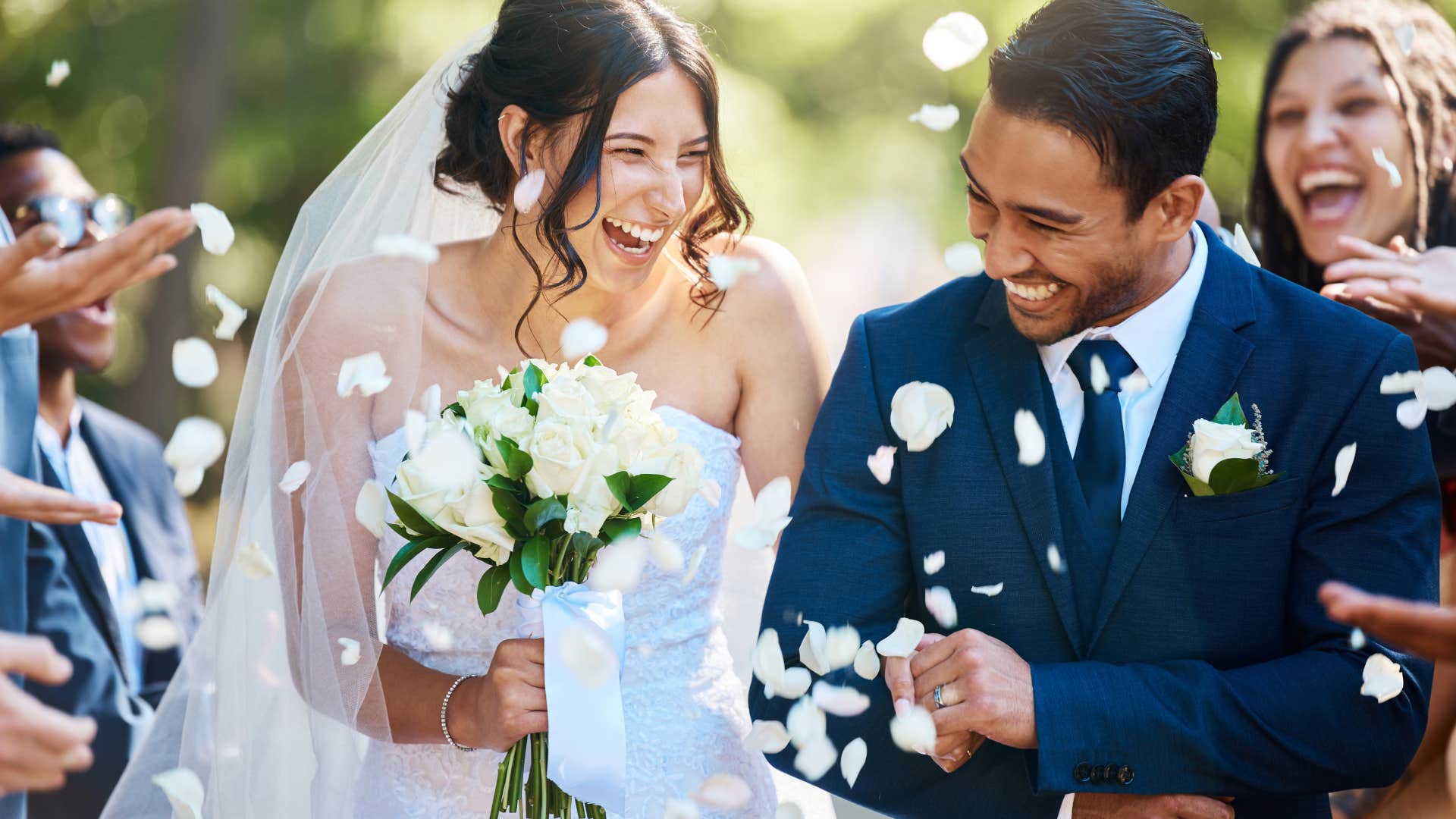 couple walking up the aisle after getting married