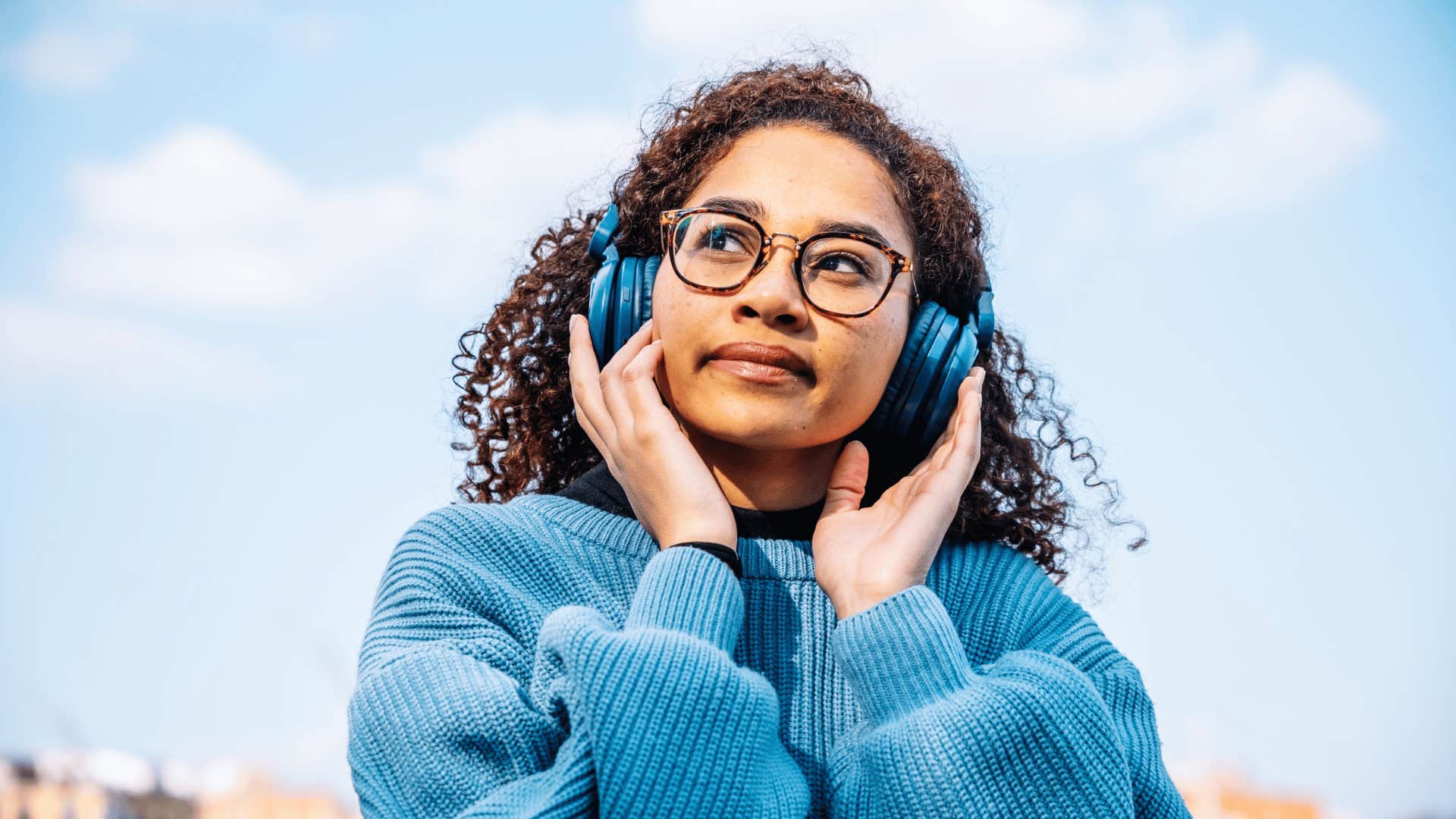 woman adapting to surroundings listening to music