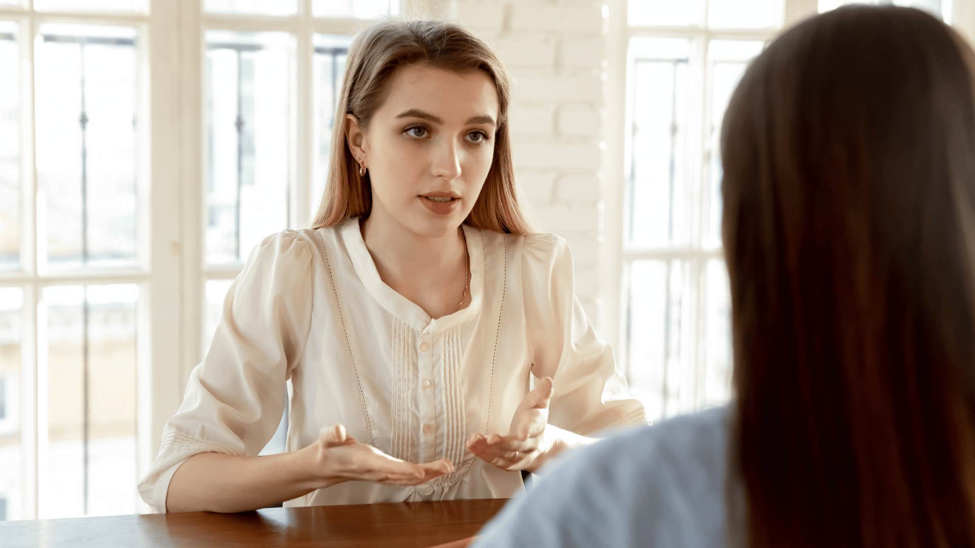 woman negotiating with coworker