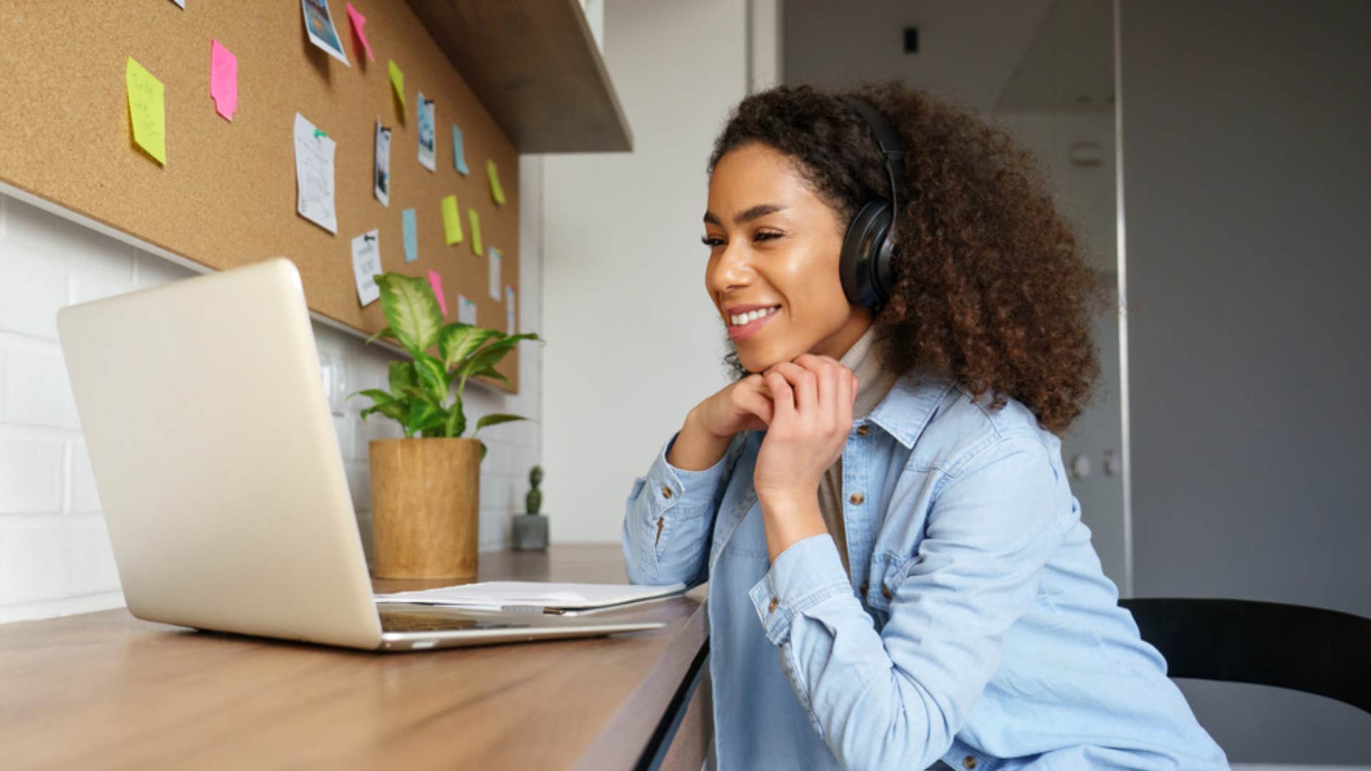 woman with headphones learning from laptop