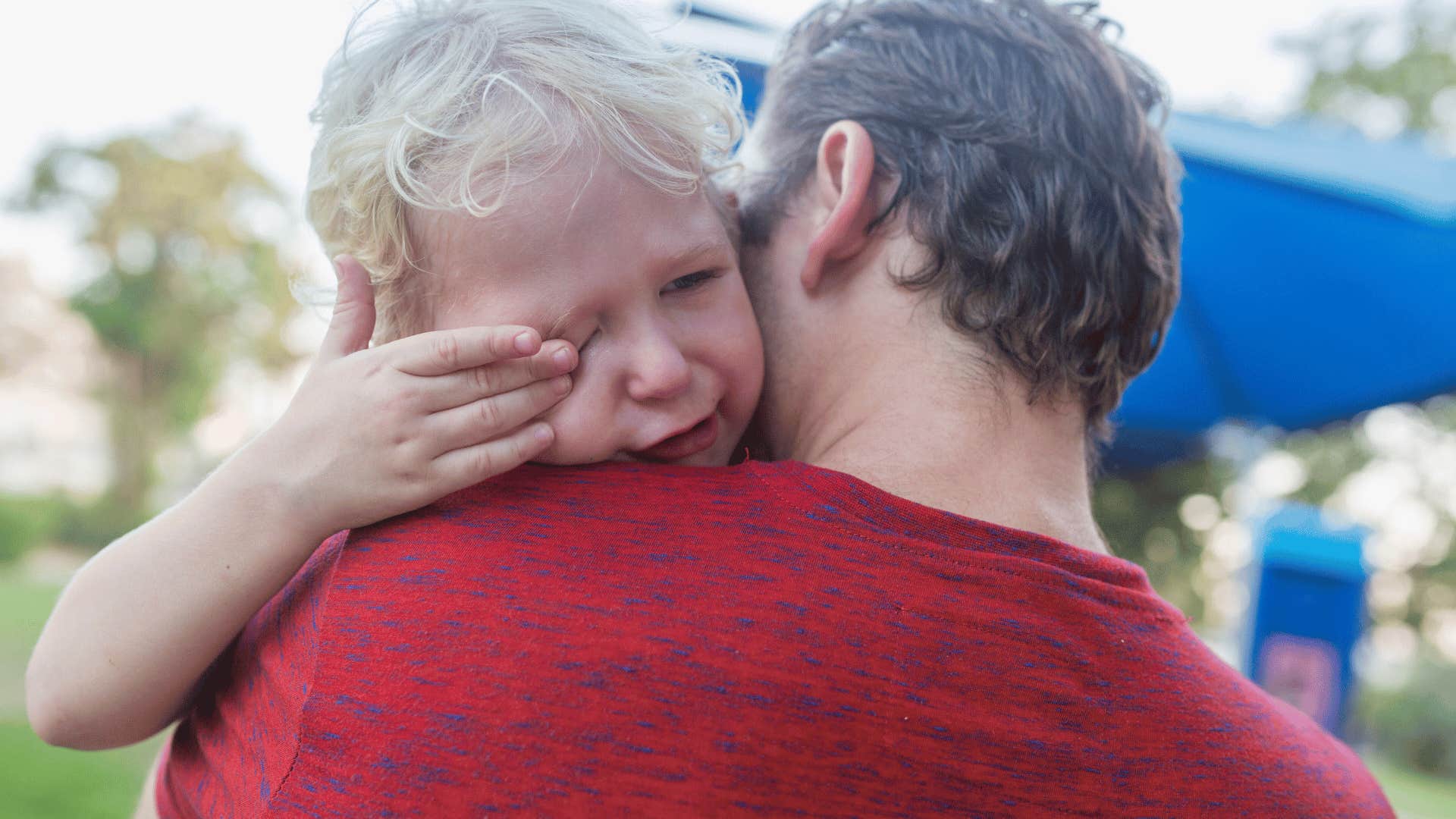 little boy trying not to cry