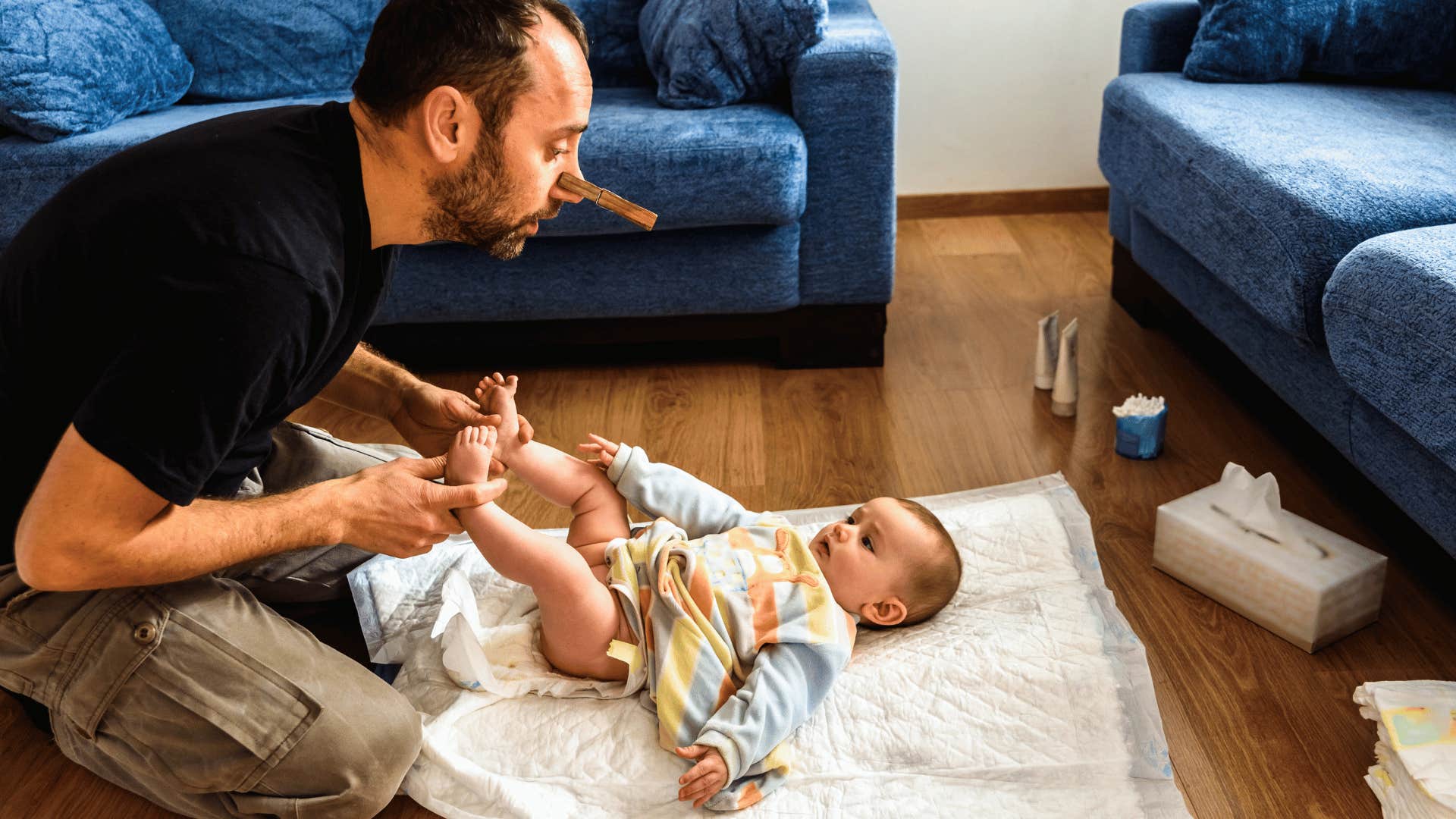 dad changing a diaper