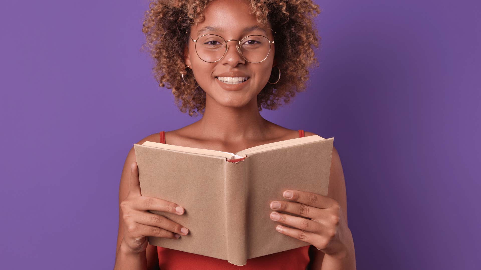 girl with paper cover on her textbook