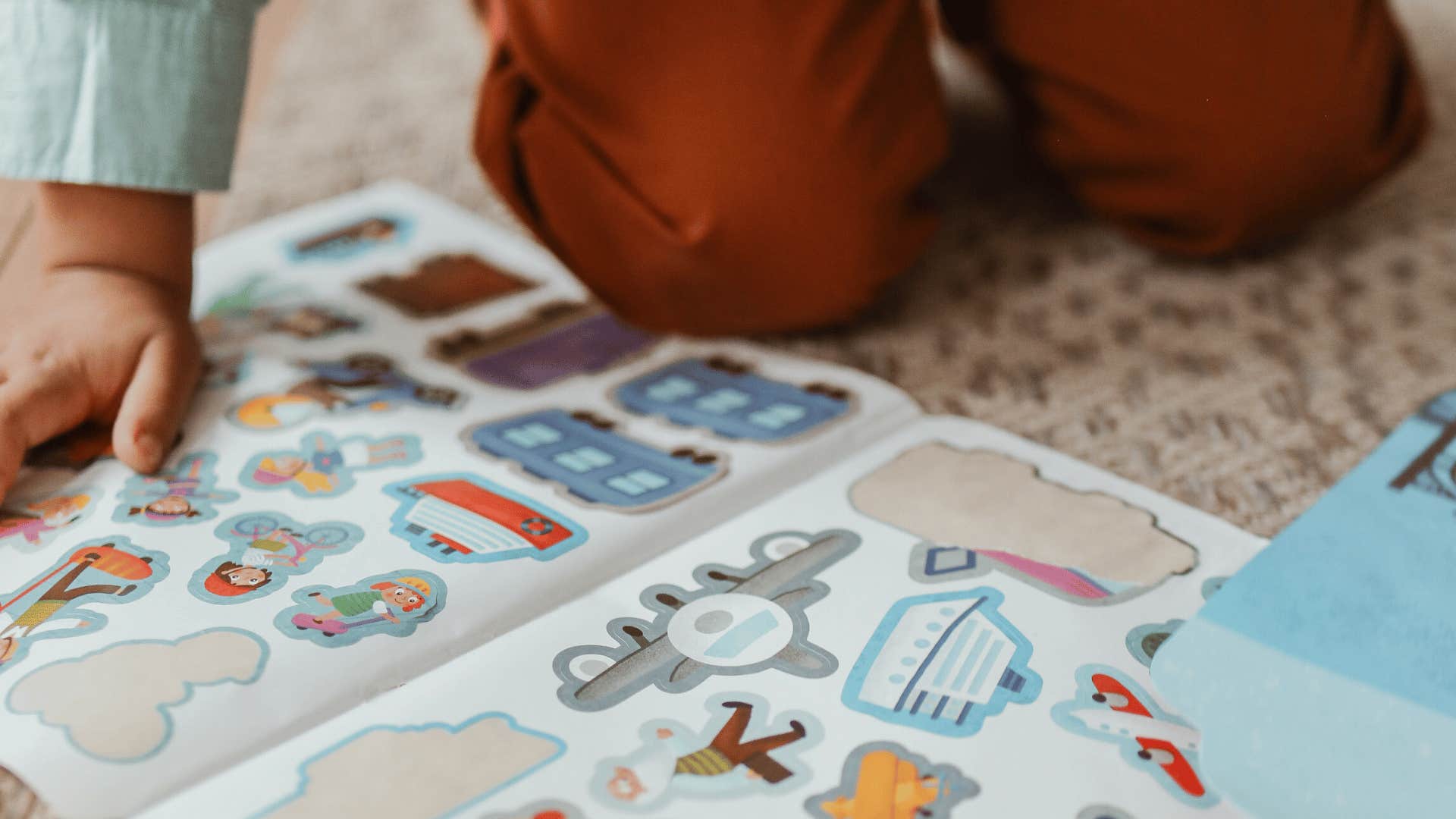 child with sticker collection