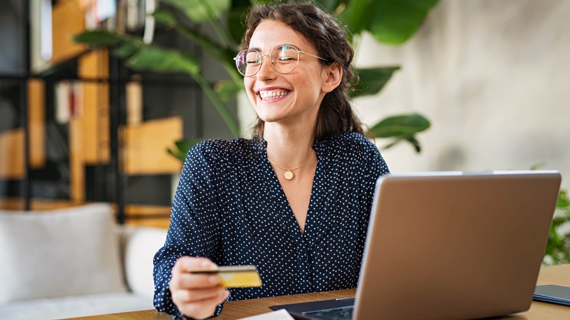 Gen Z woman smiling buying something with disposable income