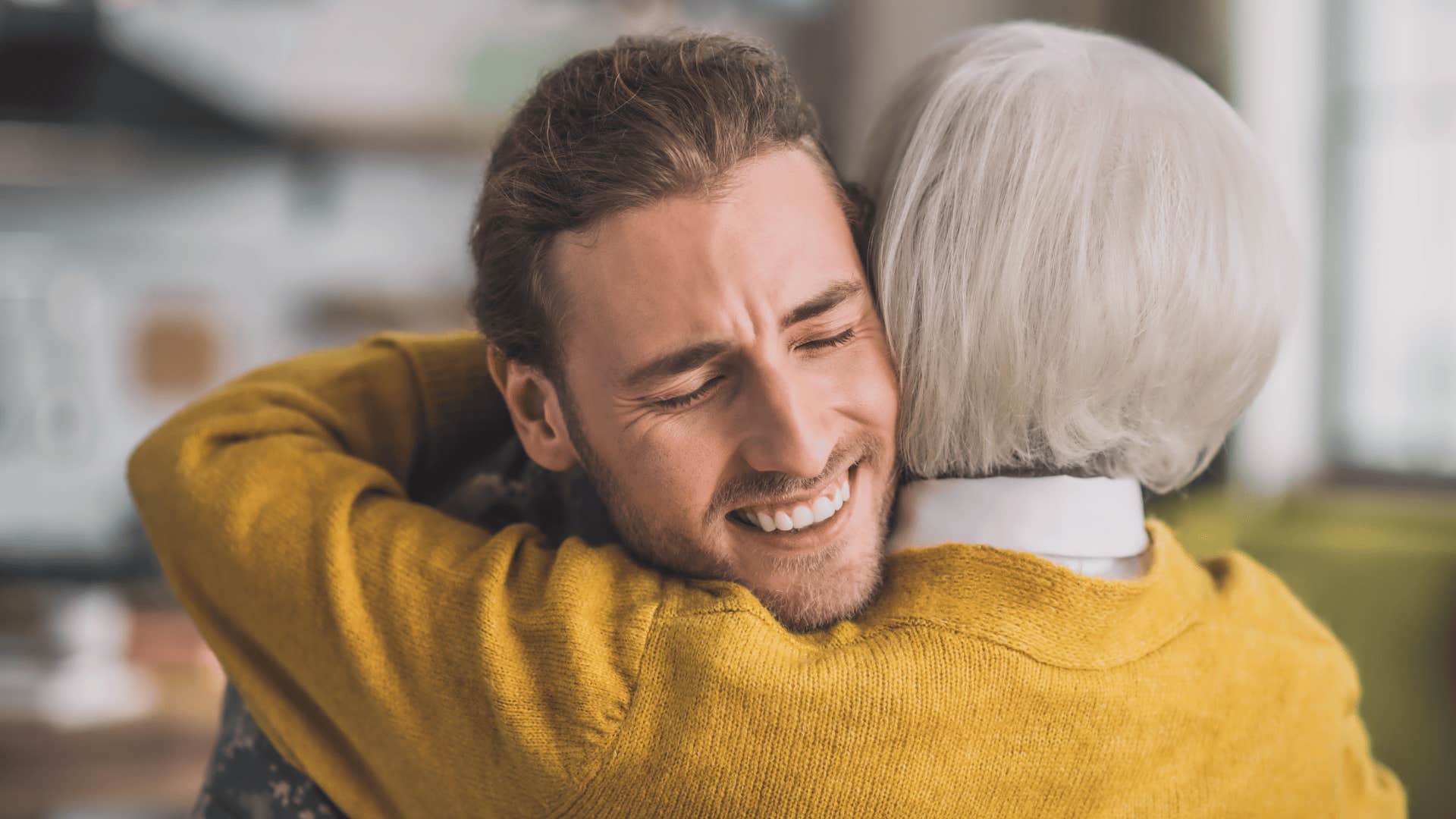 good man being hugged by his mom