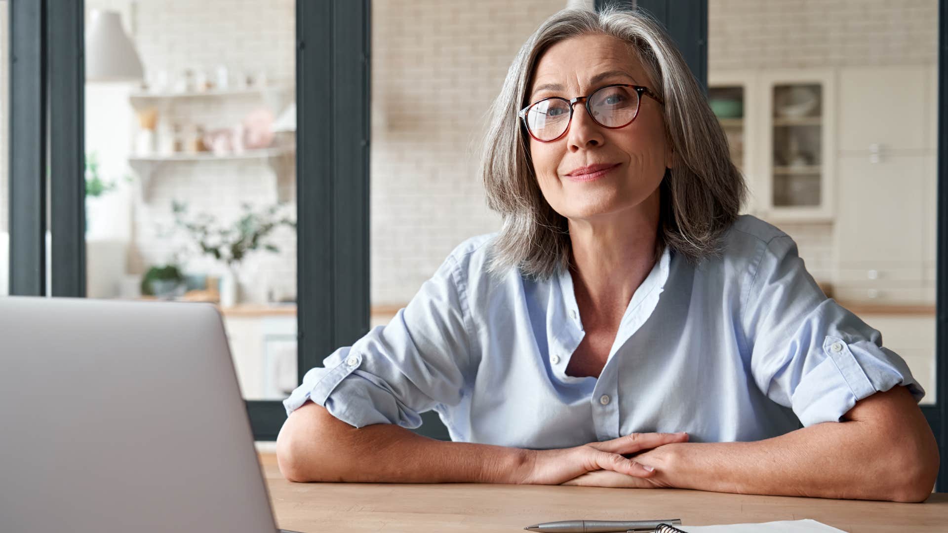 professional woman smiling while relaxing